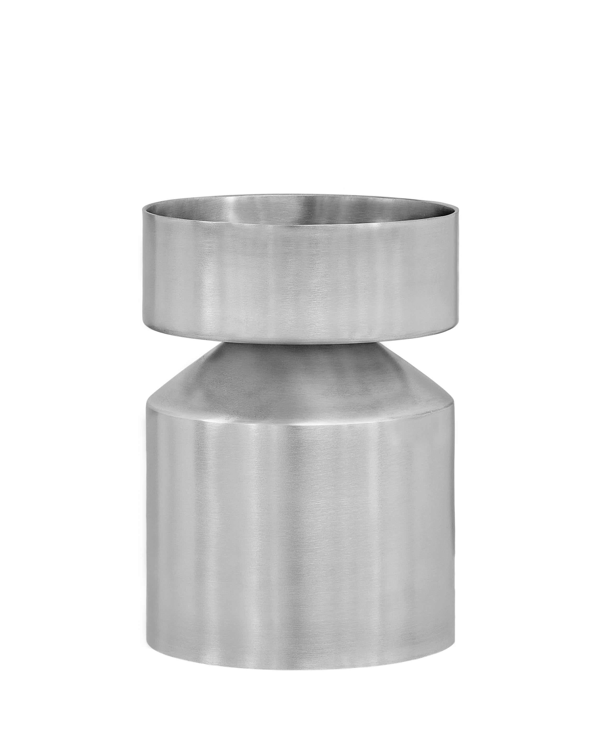 Set of 2 Small ada planters by Llot Llov
Dimensions: Ø 21 cm x H: 34 cm
Pot 1: Ø 21 cm x 26 cm; Pot 2: Ø 21 cm x 8 cm
Materials: brushed raw aluminium
Also available in black powder-coated. 

Ada Planter was made in a metal spinning process out of