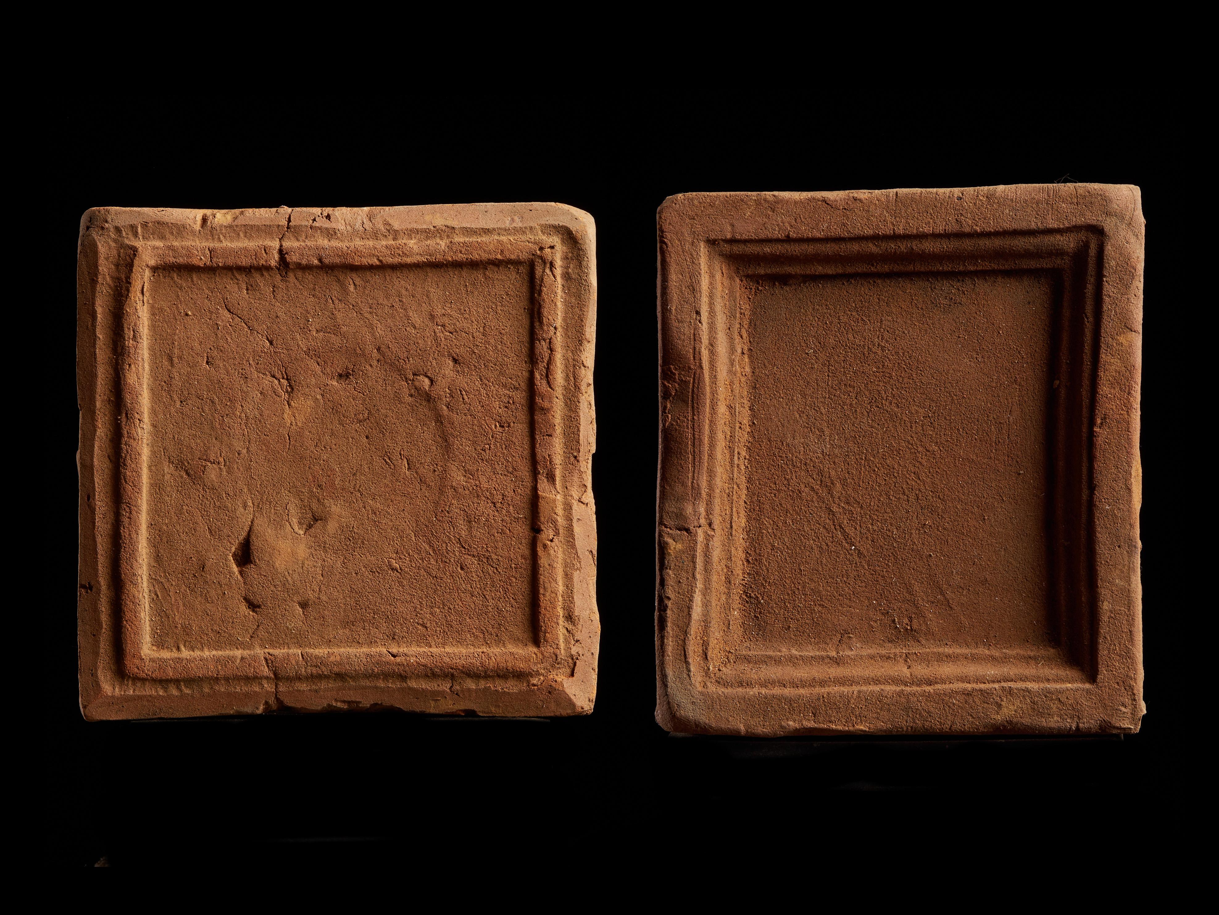 Set of 2 small antique earthenware tiles.