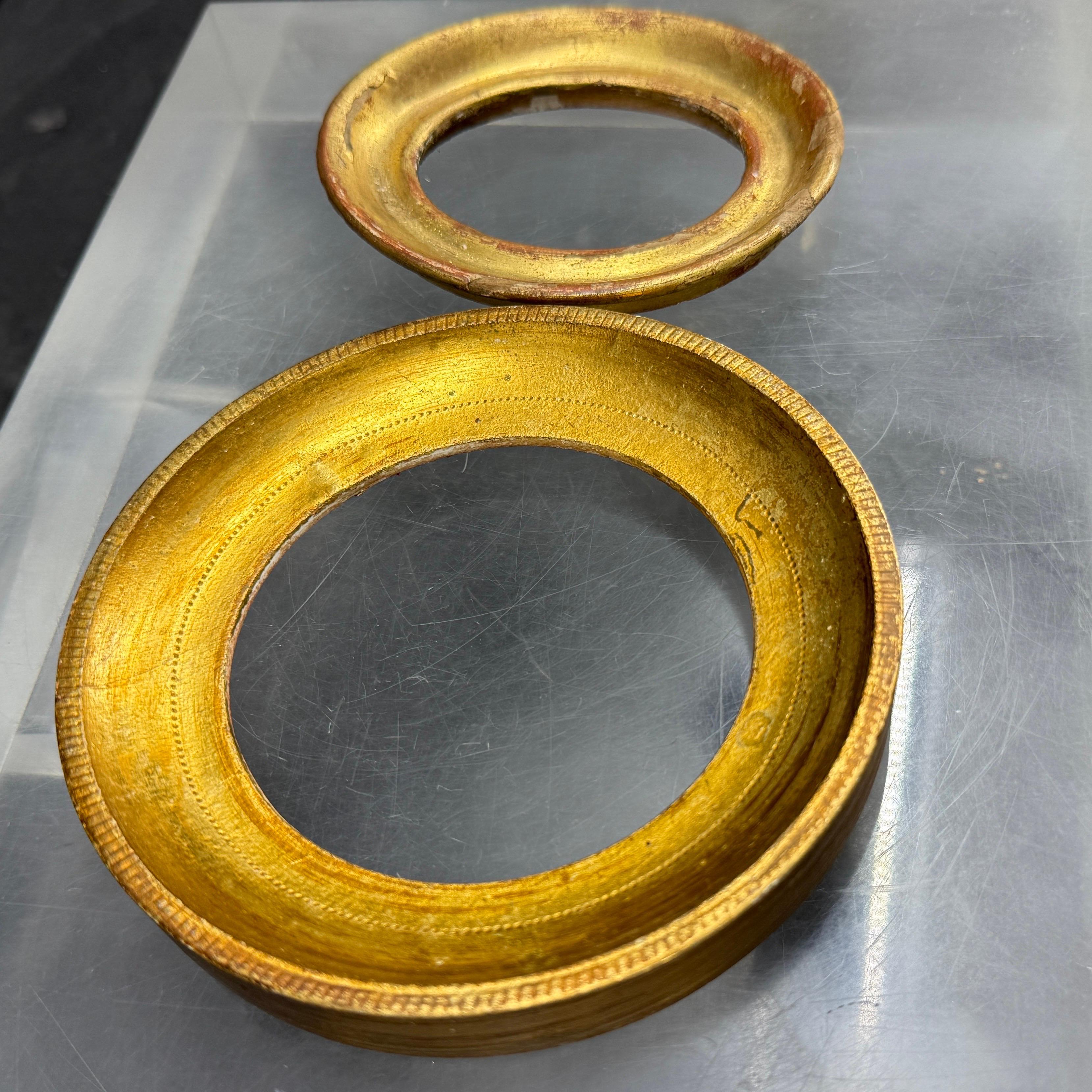 Great set of two small frames from Italy both gold gilt.  We see these as part of a gallery wall or can certainly hang alone. 

For comparison on size, the largest frame measures  0.80