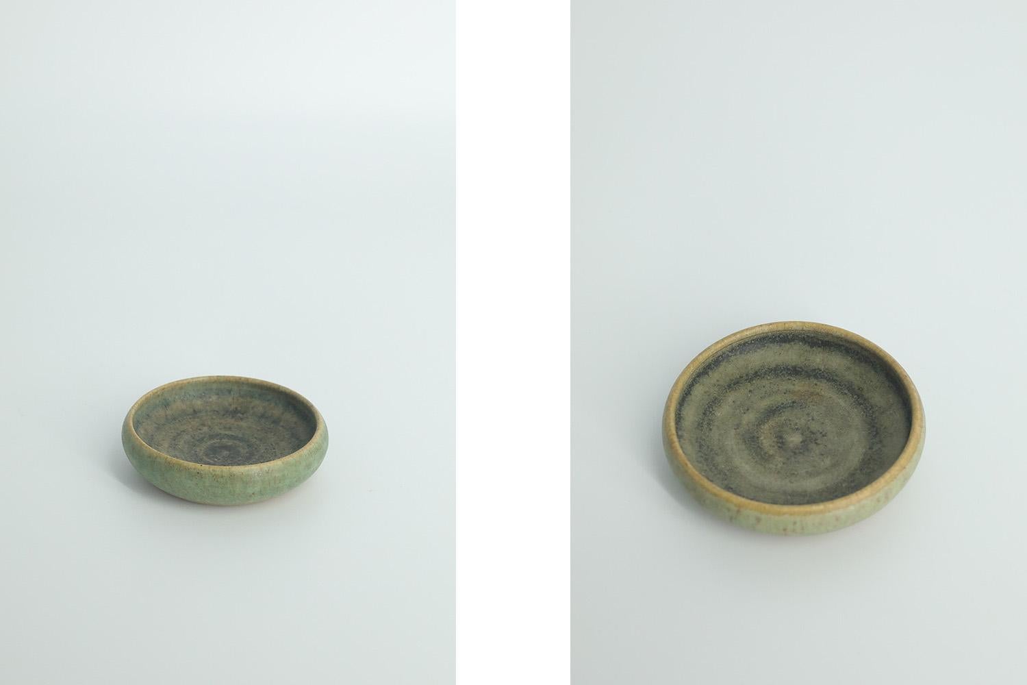This set of 2 miniature bowls was designed by Gunnar Borg for the Swedish manufacture Gunnars Keramik Höganäs during the 1960s. Handmade by the Master, with the utmost care and attention to detail. Bowls dyed in an irregular shade of sand brown and