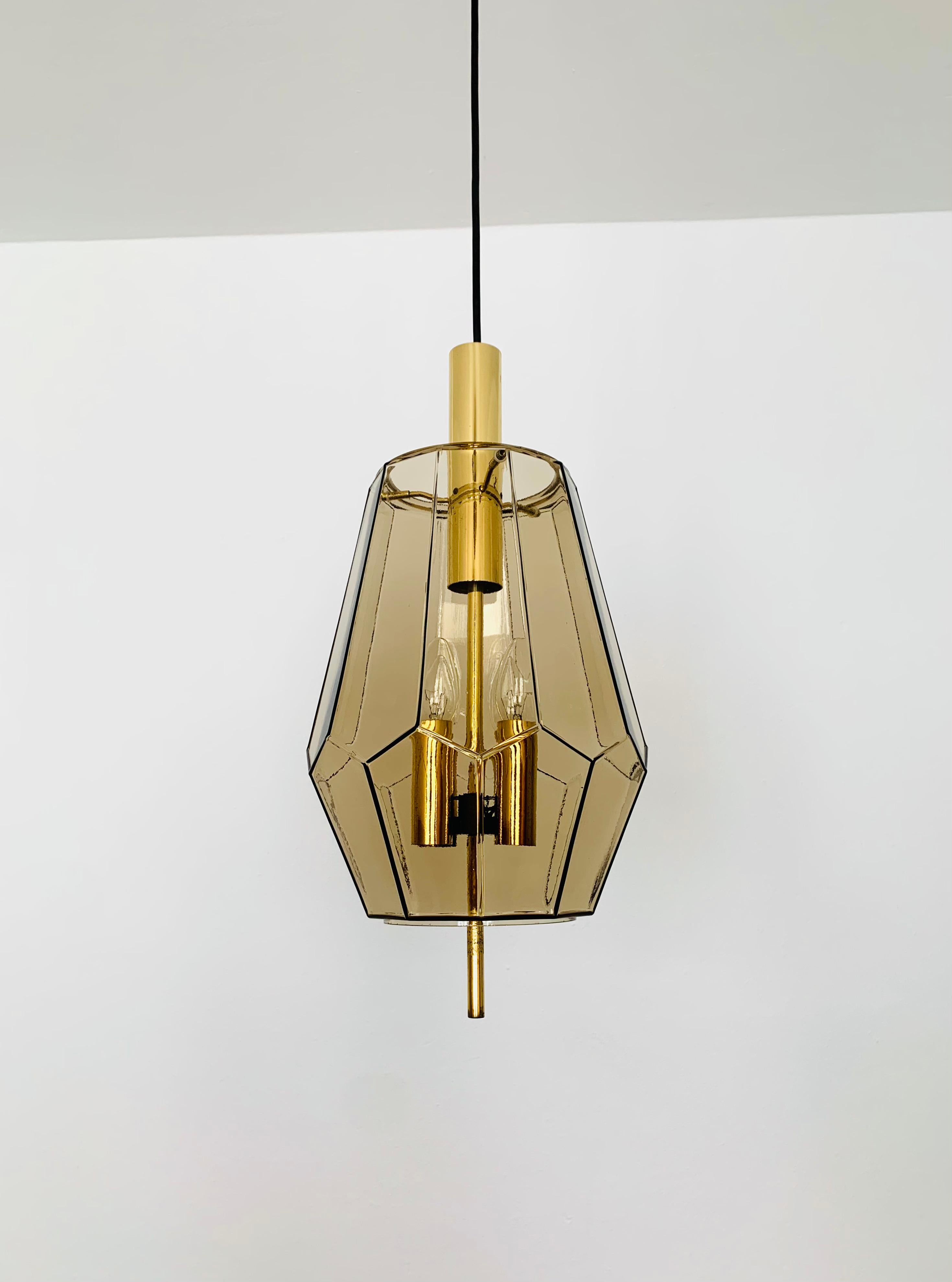 Very nice smoked glass pendant lamps from the 1960s.
The lamps spreads a great play of light in the room.
Wonderful workmanship of the highest quality.

Manufacturer: Glashütte Limburg

Condition:

Very good vintage condition with slight