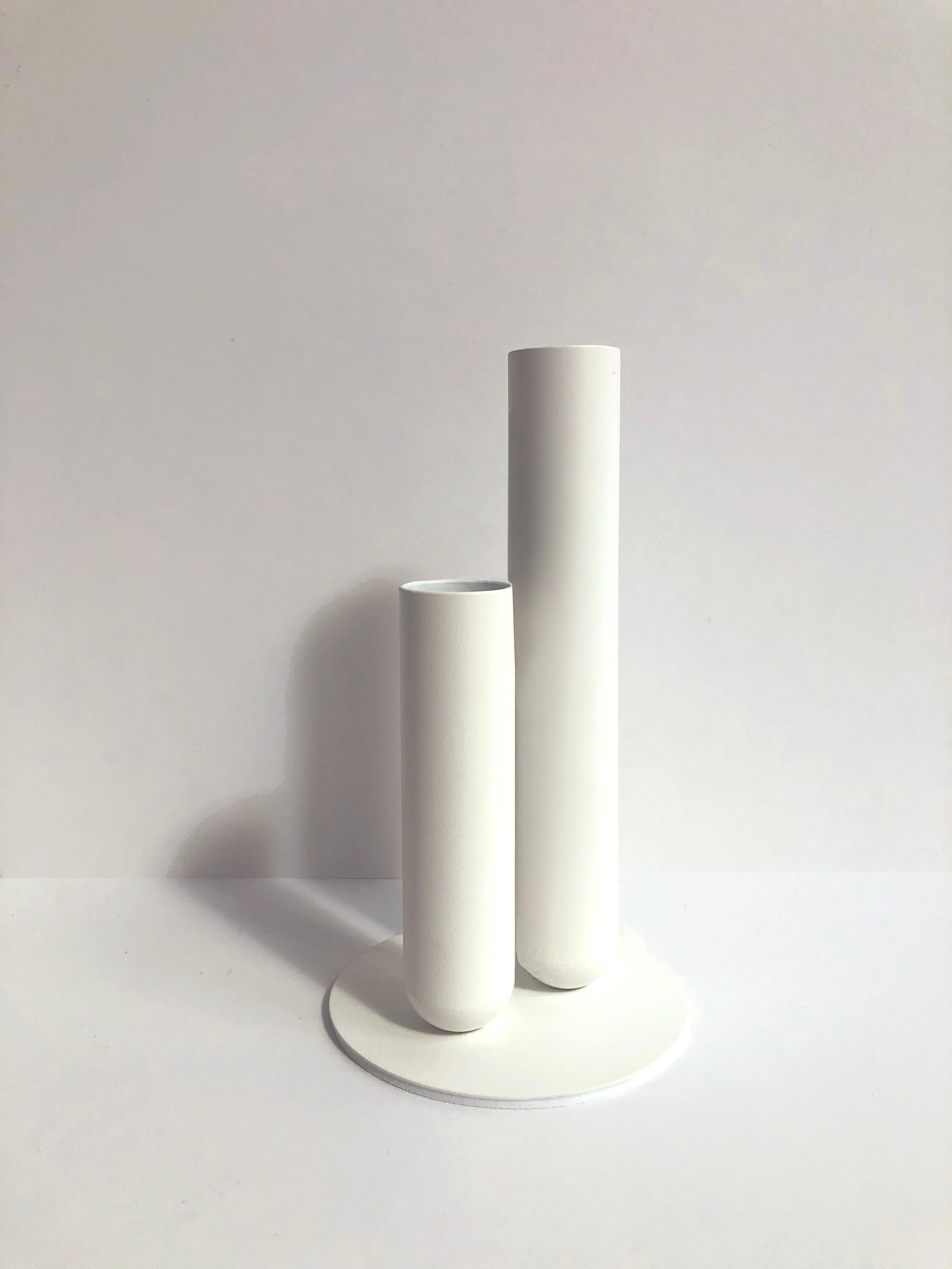 Set of 2 Soliflore White Vases by Mademoiselle Jo
Dimensions: Ø 8.5 x H 15 cm (each.)
Materials: Turned metal with magnet and EVA foam tray.

Hollow cylinders of 15 cm and 10 cm, diameter 2.5 cm. Plate diameter of 8.5 cm. Metal version with matt