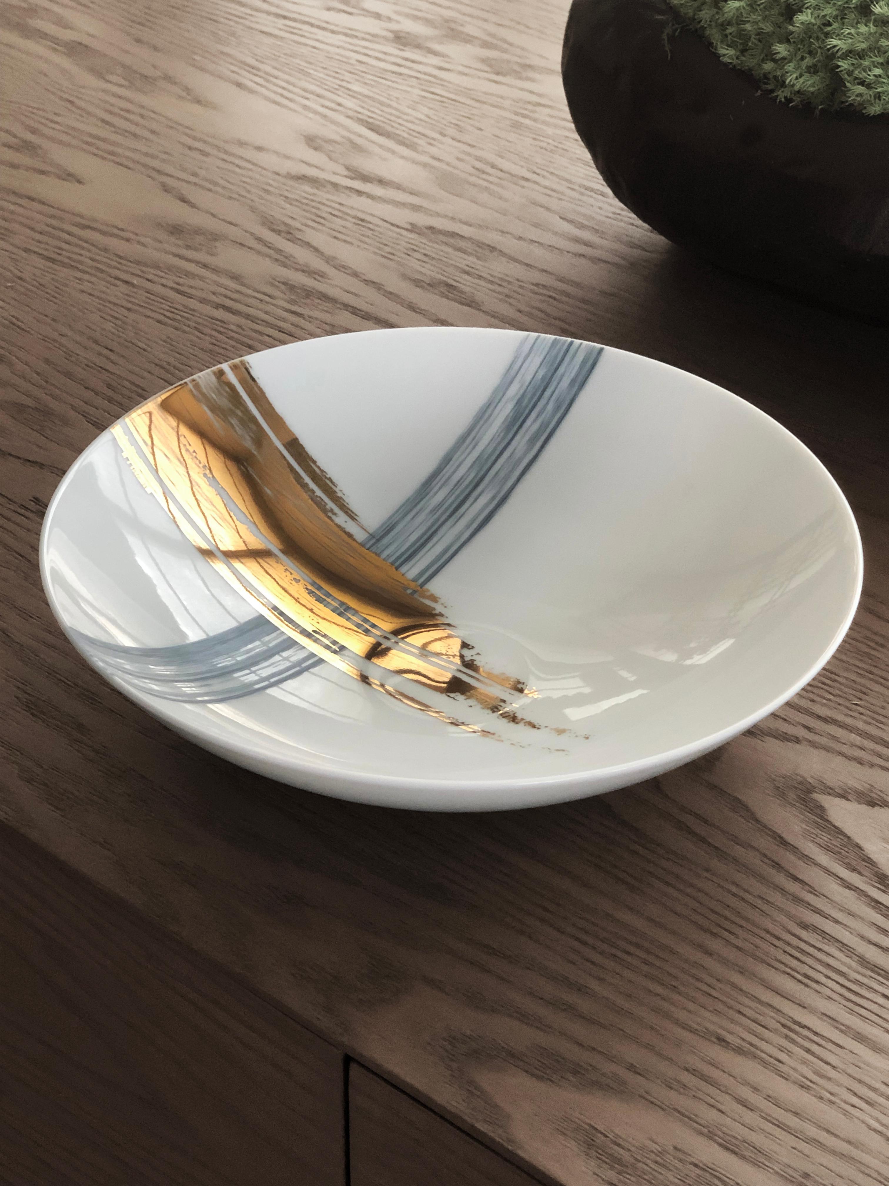 Larger quantities available upon request, with 8 weeks production time.

Description: Soup plate (2 pieces)
Color: Blue and gold
Size: 21 Ø x 5 H cm
Material: Porcelain and gold
Collection: Artisan Brush.