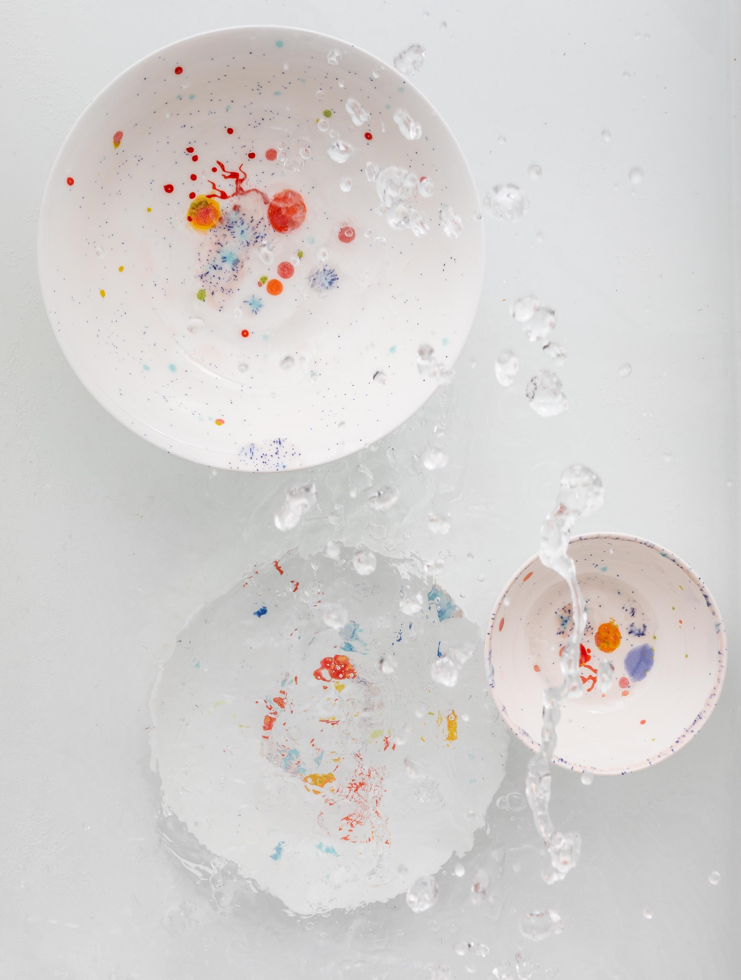 Handcrafted in Italy from the finest porcelain, these white seabed soup coupe plates have corals lying on a bright bottom surrounded by mysterious multicolored gems floating amid brushes of light pink sand sprinkled with black dots.

Set of