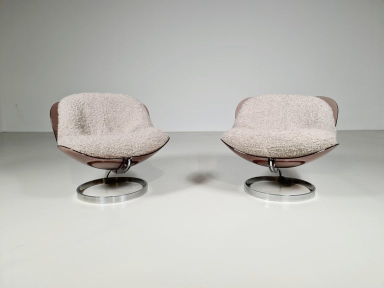 Set of beautiful and rare ’Sphere’ lounge chairs. Designed by Boris Tabacoff in 1971. Manufactured by the French MMM. factory (Mobilier Modular Moderne) These chairs have a characteristic brown lucite shell which holds a thick cushion. The cushion