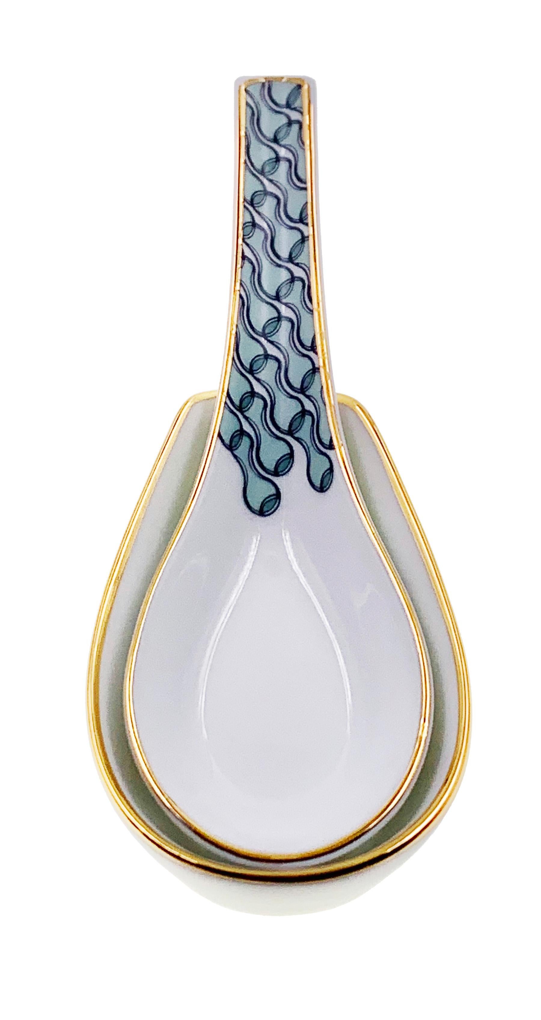 Larger quantities available upon request, with 8 weeks production time.

Description: Chinese spoon with spoon holder set (2 pieces)
Color: Sage green
Size: 13.5 x 4.5 H, 9 x 5.5 x 2 H cm
Material: Porcelain and gold
Collection: Mid Century Rhythm