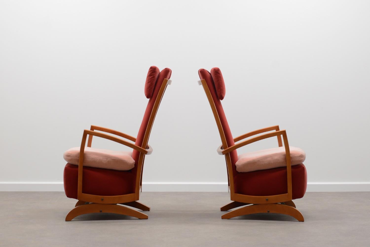 Set of 2 rare rocking chairs 80s in a art deco style. Beech wood frame with red velvet upholstery and fabrik seat cushion. This rocker has a spring rocking system. In very good vintage condition. Price for the set of 2.