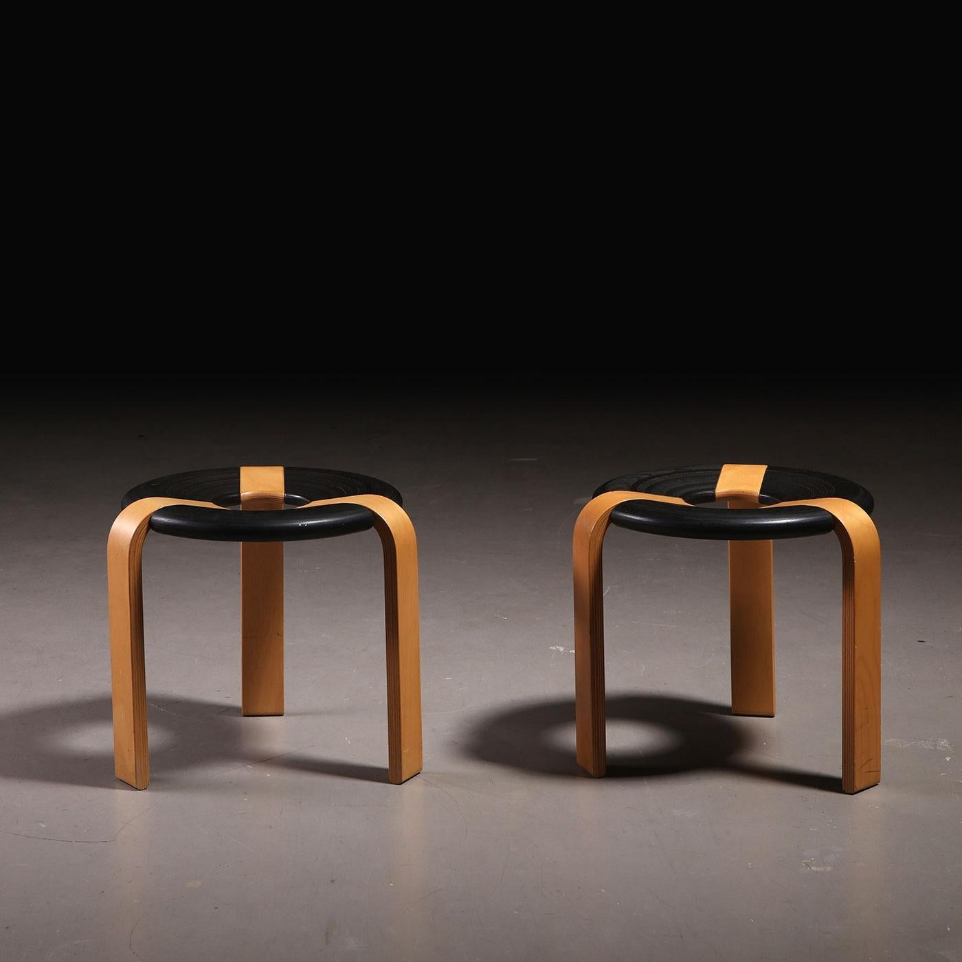 Set of 2 rare Scandinavian stackable stools designed by Rud Thygesen and Johnny Sørensen for Magnus Olesen in the 1970s, Denmark.

These unique donut-shaped stools are made from oak wood and each features a black painted oak circular seat with 3