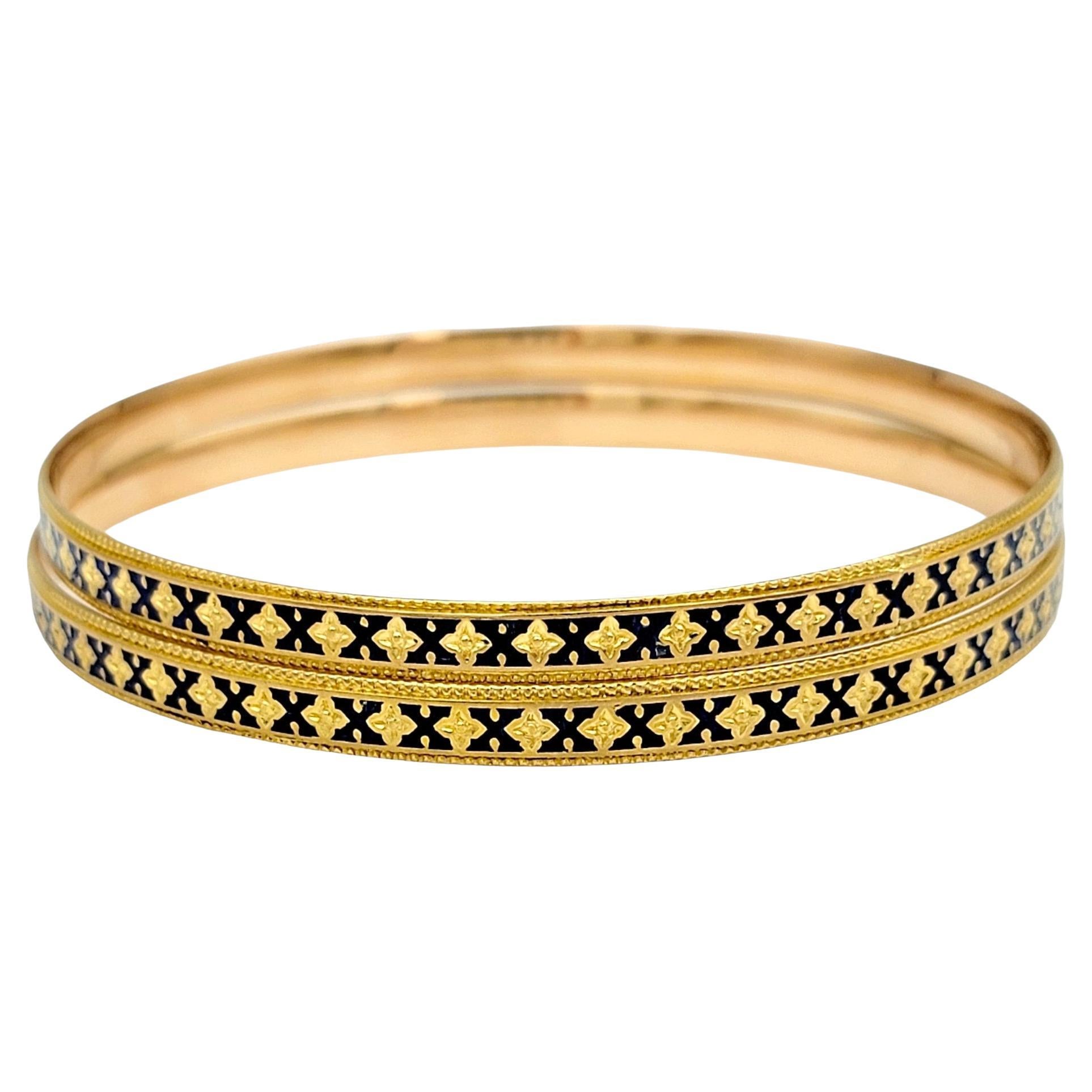 Introducing a stunning set of 2 stacking bangle bracelets, crafted in luxurious 22 karat yellow gold, offering a timeless blend of elegance and versatility. Each bracelet features a delicate gold milgrain edging that adds a touch of refinement and