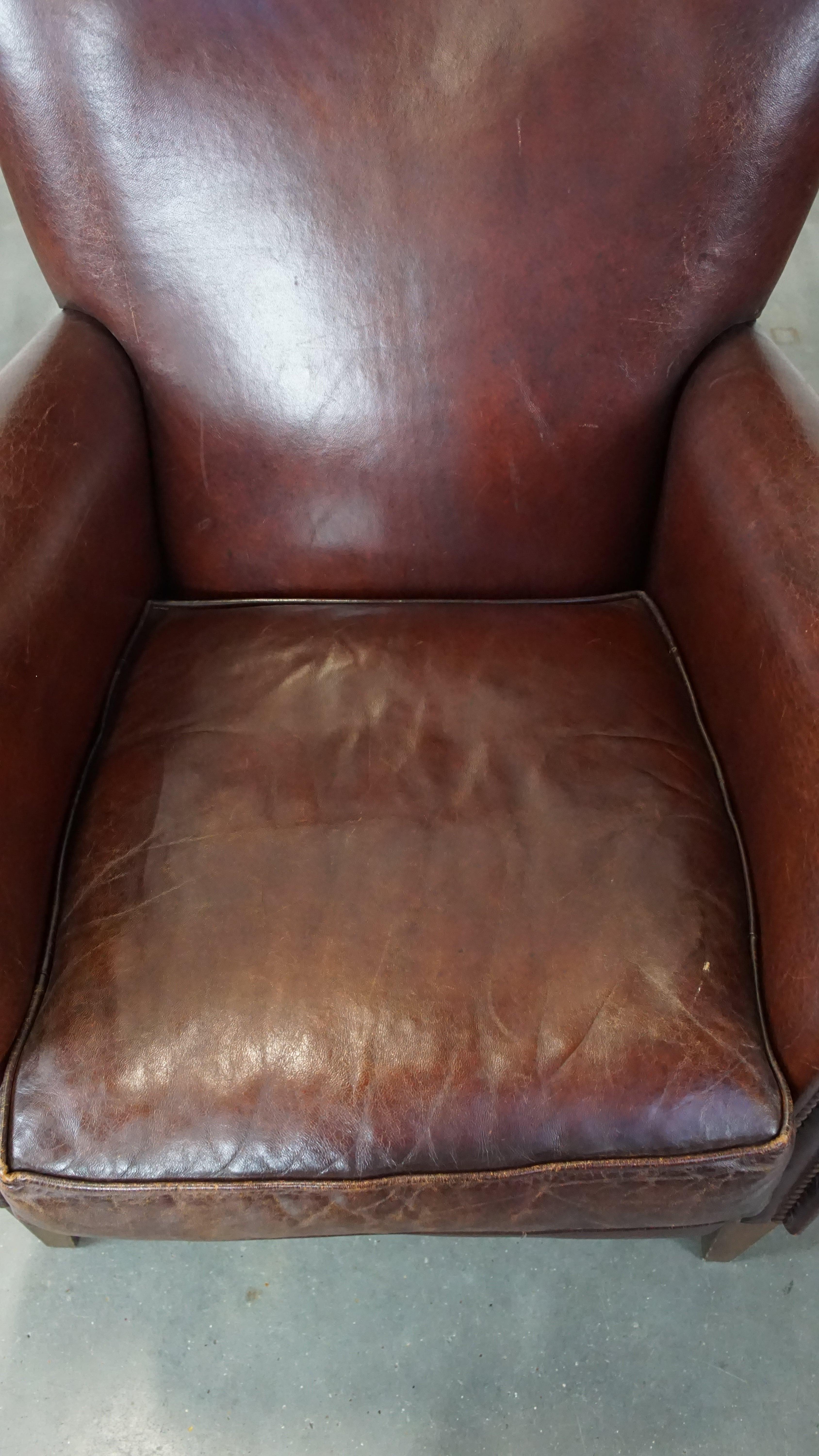 20th Century Set of 2 stately sheepskin armchairs with proper finishing with decorative nails For Sale