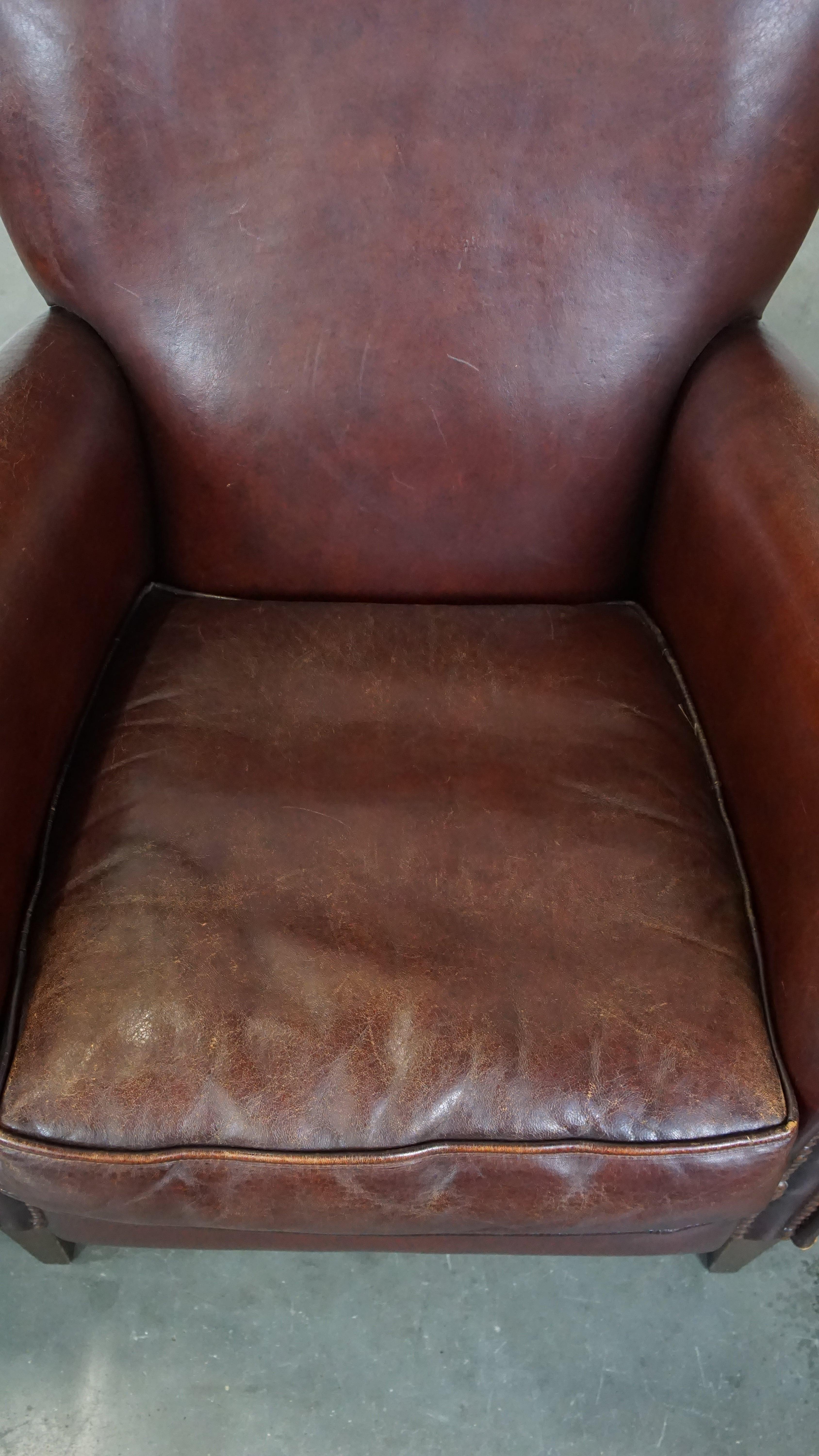 Sheepskin Set of 2 stately sheepskin armchairs with proper finishing with decorative nails For Sale