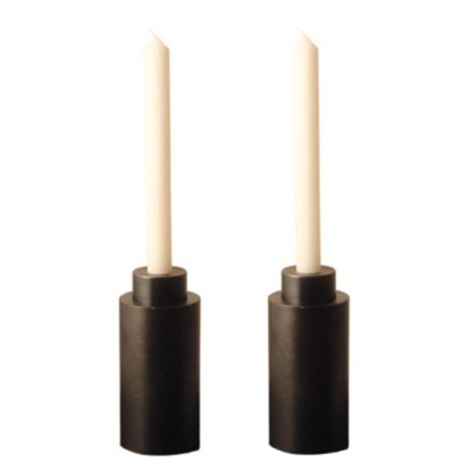 Set of 2 steel bold candleholders by Radu Abraham.
Materials: Steel.
Dimensions: D6 x H12cm.

2 piece candle holder; can be used with multiple types of candles or with standard candle pill; if detached from each other, each element can be used