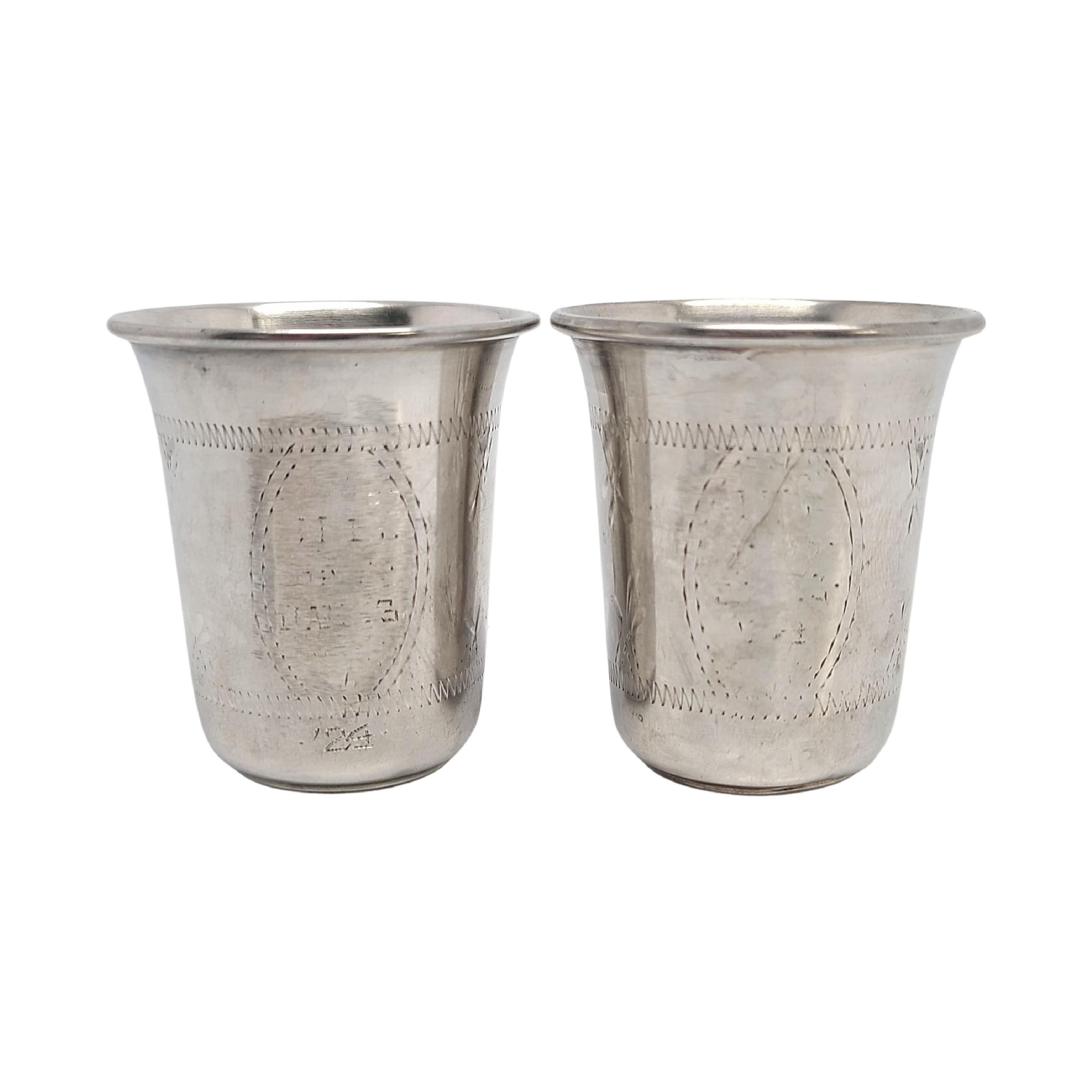 Set of 2 sterling silver kiddush cups.

Beautiful bright cut etched design featuring the Star of David. One panel looks like an engraving has worn off.

Each cup measures 1 3/4