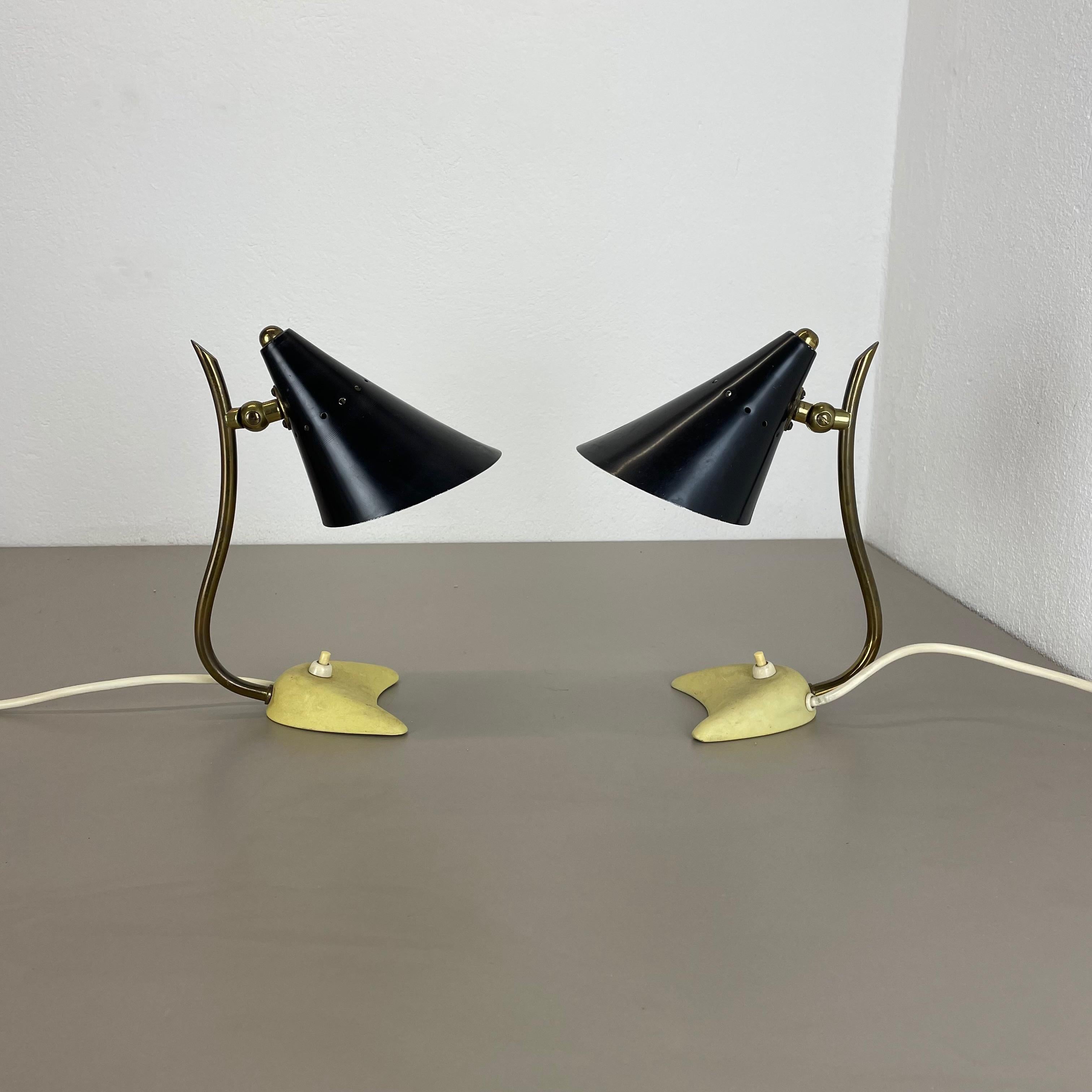 Article:

Modernist metal brass table light set of 2


Origin:

Italy


Decade:

1950s





This original vintage light set was designed and produced in the 1950s in Italy. The light is made of metal with a shade in black and stand