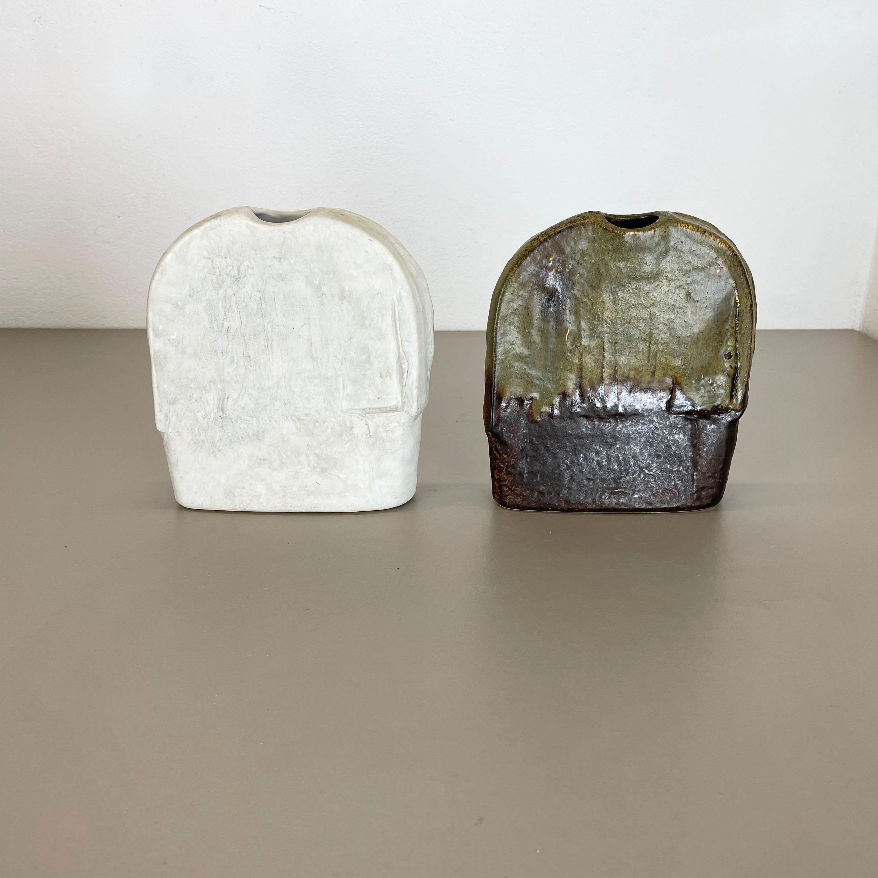 Article:

Ceramic vase object set of 2


Design: 

Heiner Balzar


Producer:

Steuler, Germany



Decade:

1970s


This original vintage ceramic object set was produced by Steuler in the 1970s in Germany. Its was designed by