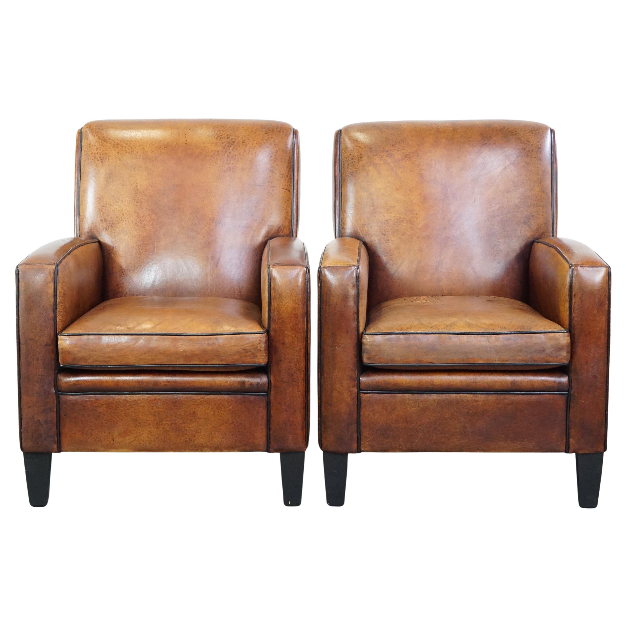 Set di 2 poltrone robuste ma comode in pelle di pecora dal design elegante