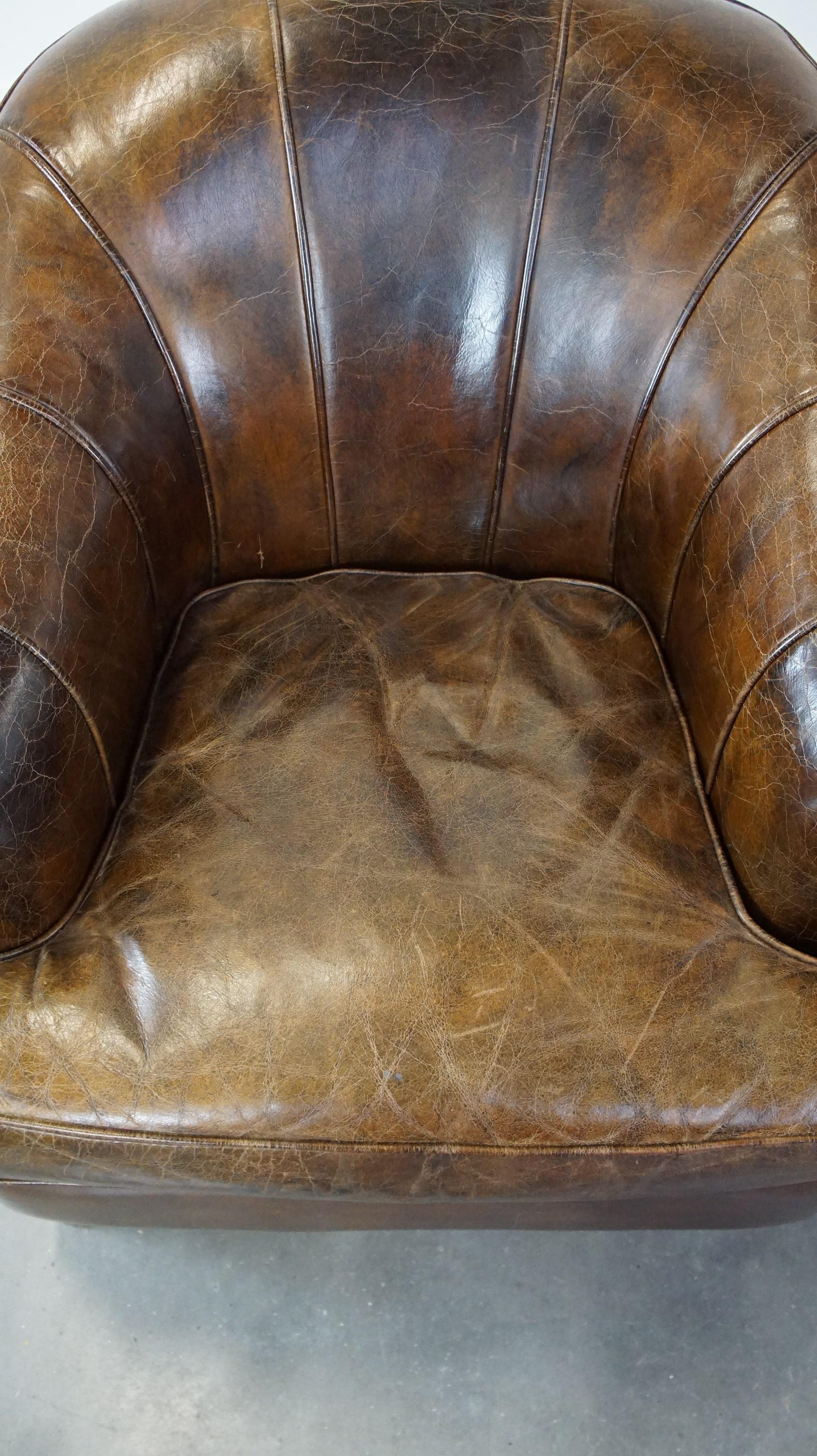 Set of 2 sturdy design armchairs made of cowhide with a beautiful deep color In Fair Condition For Sale In Harderwijk, NL