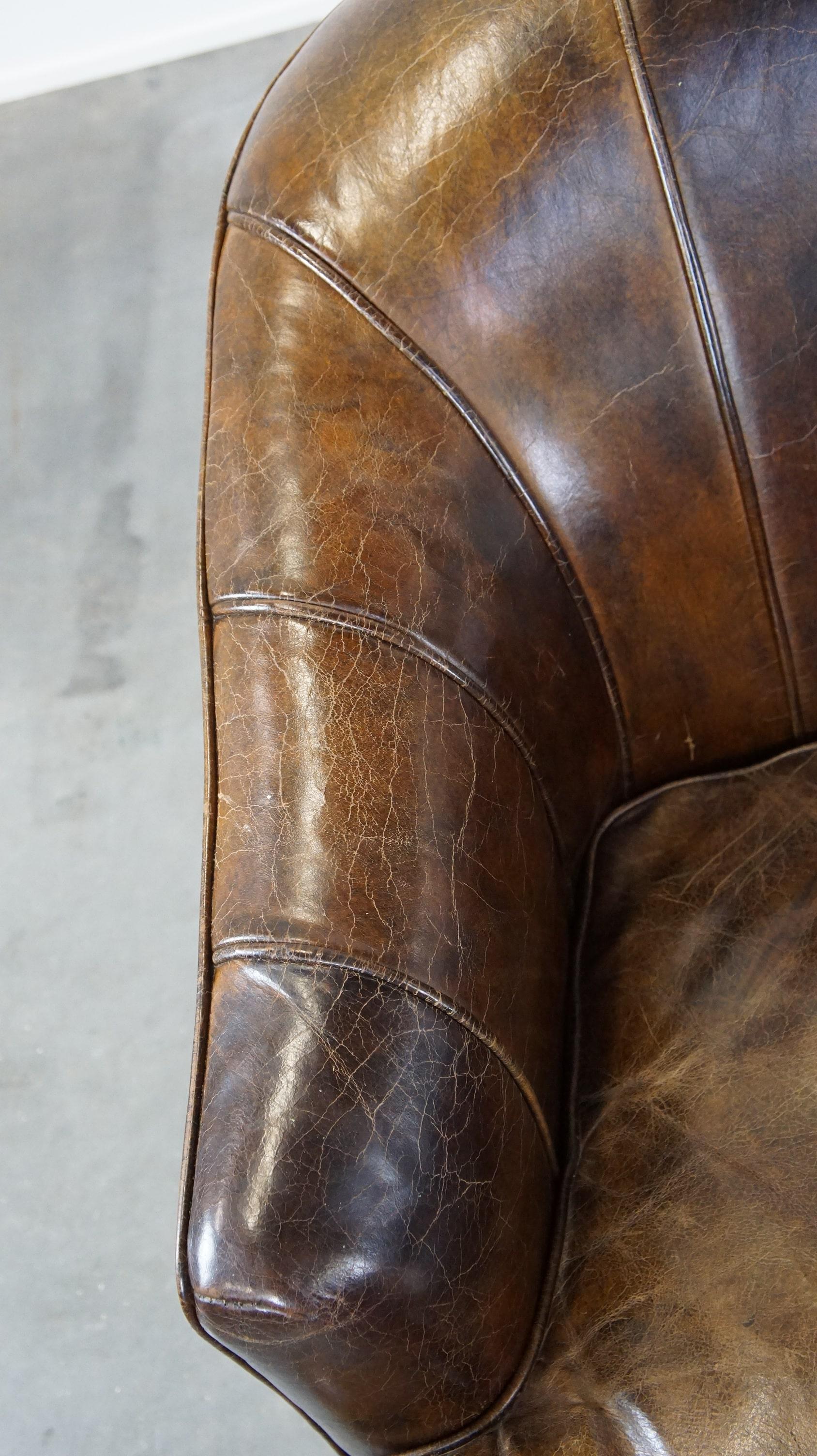 Cowhide Set of 2 sturdy design armchairs made of cowhide with a beautiful deep color For Sale