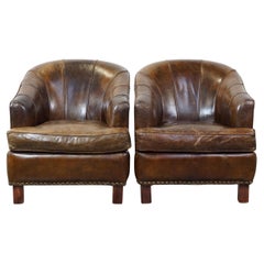 Conjunto de 2 sillones de diseño robusto fabricados en piel de vacuno con un bonito color intenso
