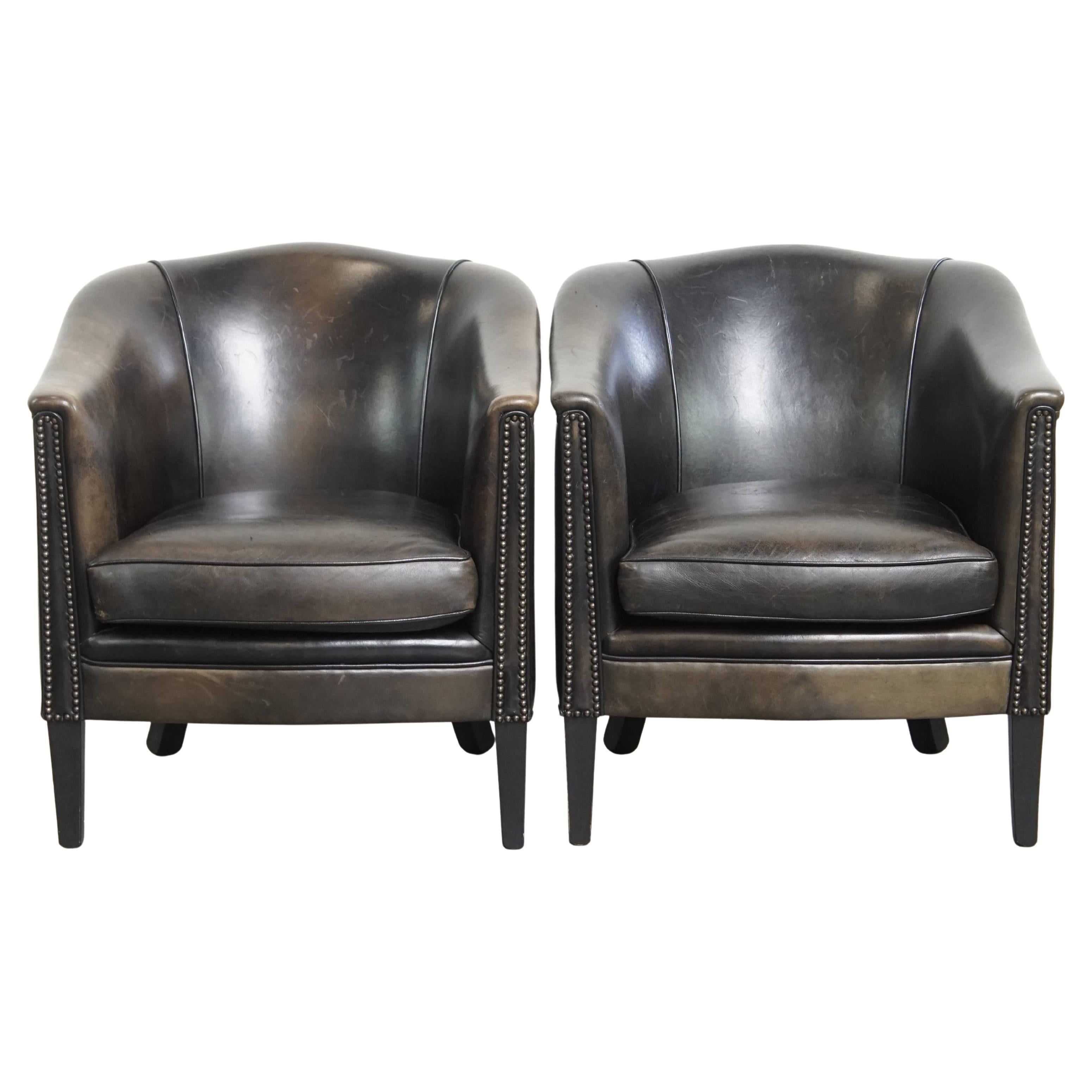 Juego de 2 sillones club de piel de cordero sutil negro/gris en venta