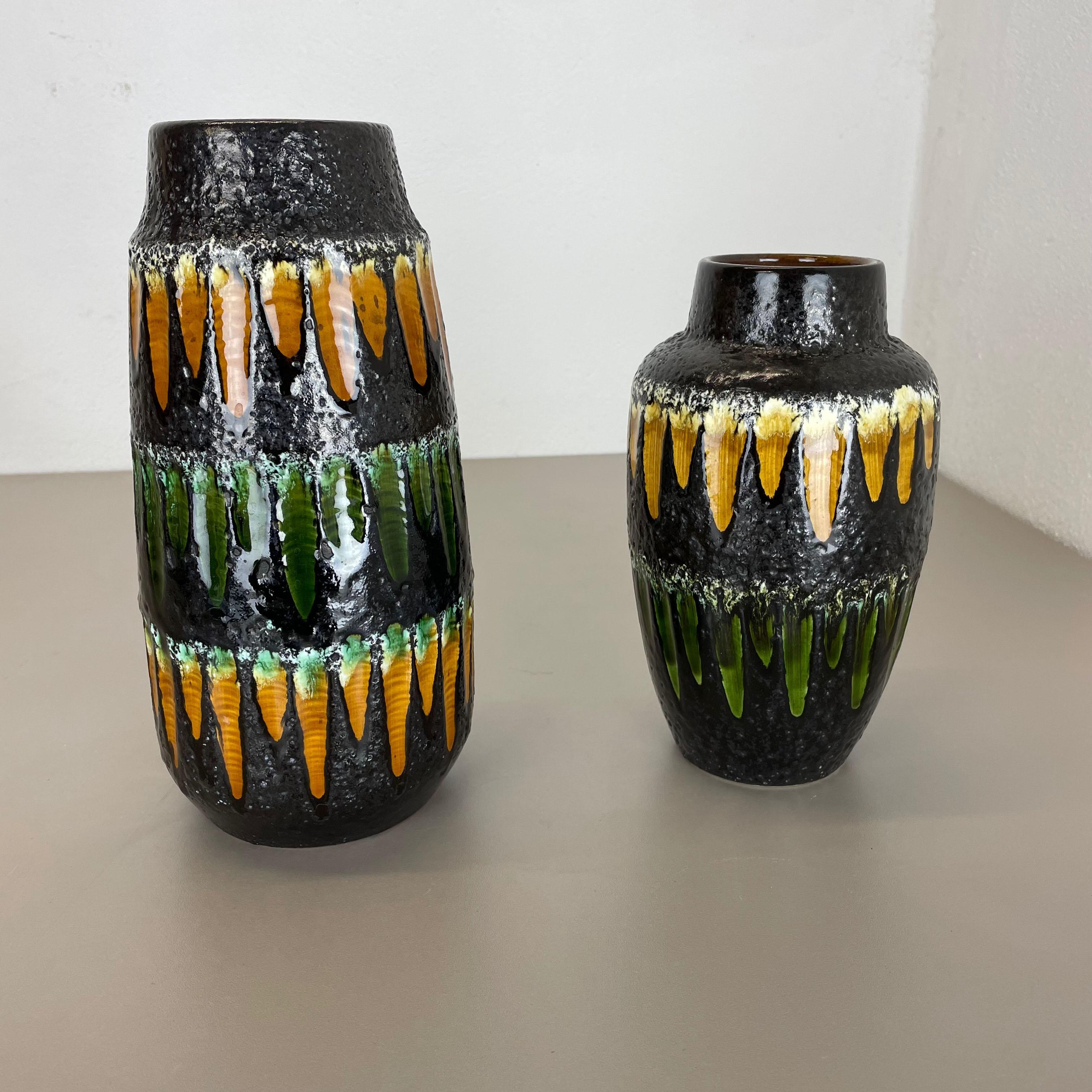 Article:

Fat lava art vase, heavy Brutalist glaze, set of 2


Producer:

Scheurich, Germany



Decade:

1970s




This original vintage vase set was produced in the 1970s in Germany. It is made of ceramic pottery in fat lava optic with abstract