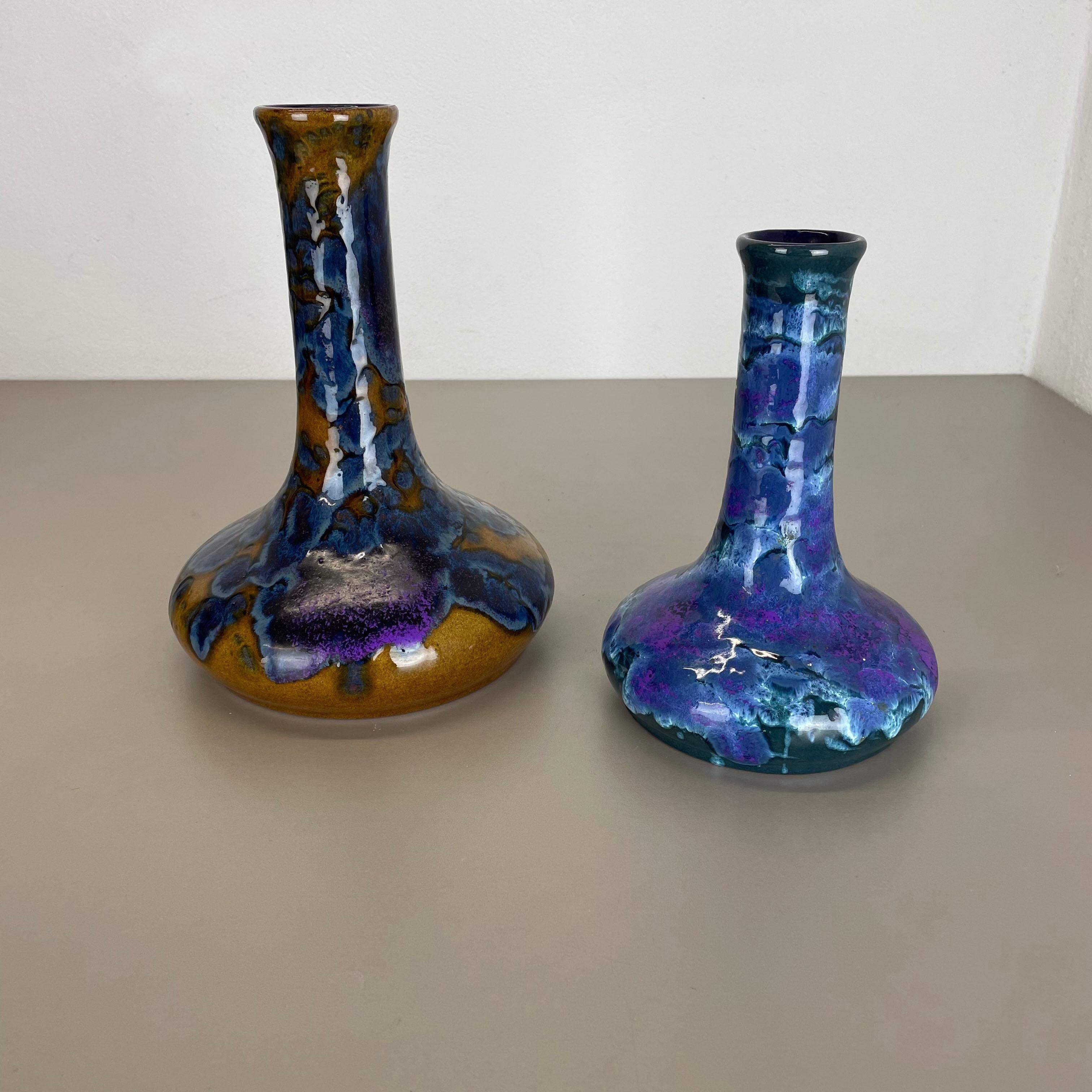 Article:

Ceramic fat lava vases set of 2


Producer:

Marei Ceramics, Germany


Decade:

1970s





Set of 2 original vintage Studio Pottery vases was produced in the 1970s by Marei Ceramics, Germany. Rare set of 2 vase from the