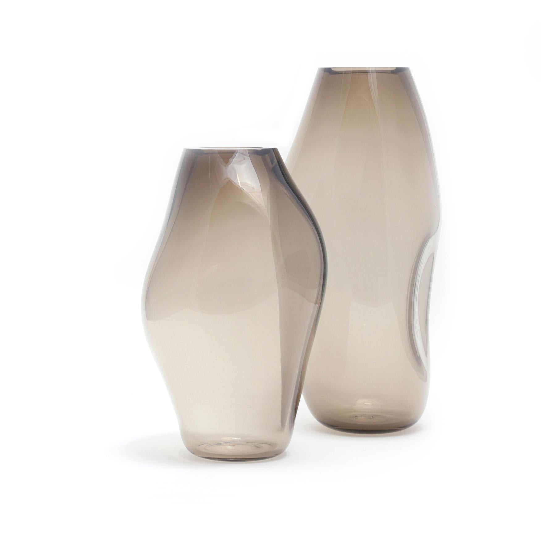 Set of 2 Supernova IV silver smoke M/L vases by Eloa
No UL listed 
Material: glass
Dimensions: D 16 x W 18 x H 49/ D 15 x W 17 x H 36 cm
Also available in different colours and dimensions.

Supernova is a collection of vases and bowls that, though