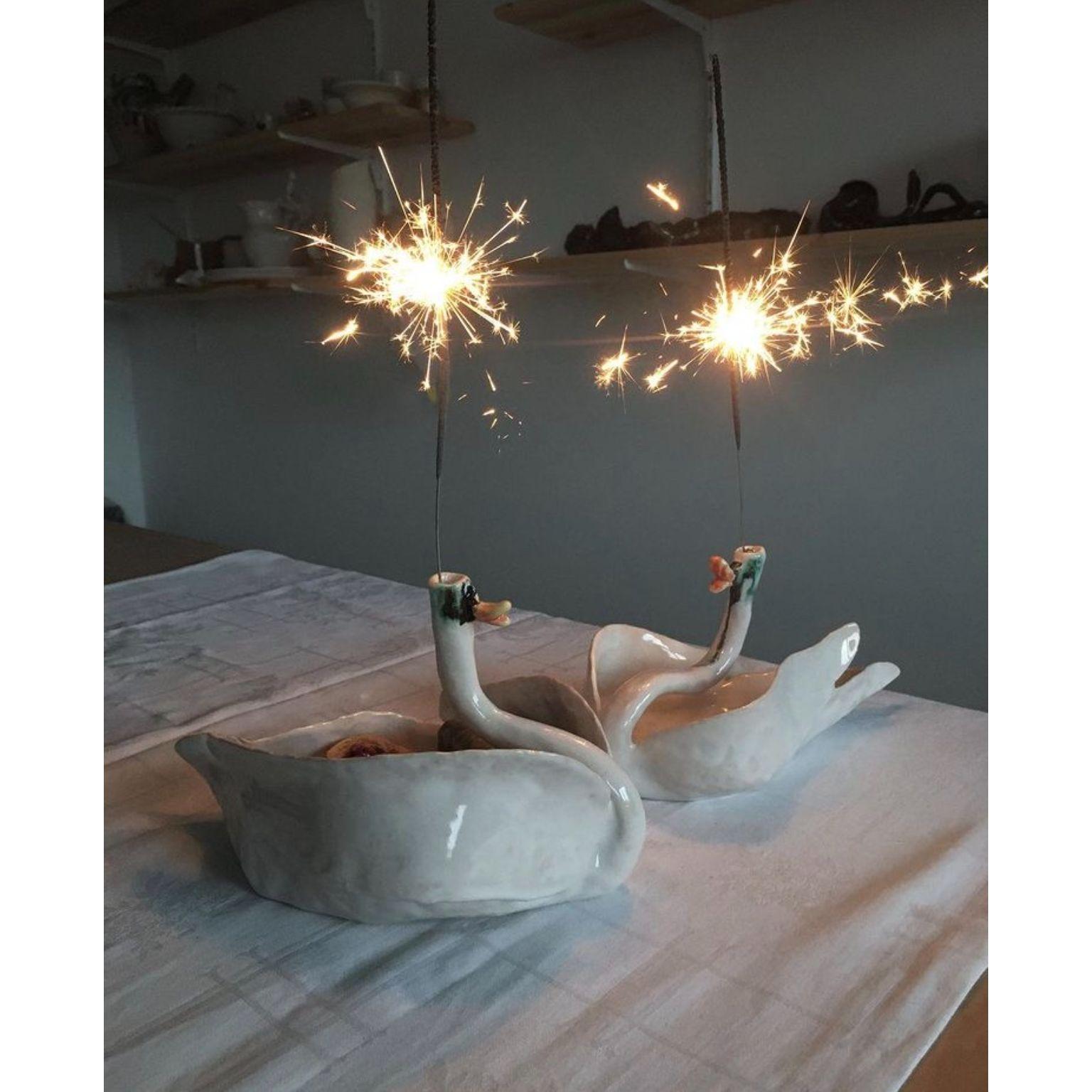Set of 2 swan candle holder bowls by Ana Botezatu
Dimensions: D 22 x W 13 x H 13 cmn // D 21 x W 10 x H 11 cm.
Materials: glazed earthenware.

Ana Botezatu (b. 1982, Bra?ov (former Kronstadt), Romania) lives and works in Berlin. She works with