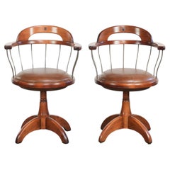 Set of 2 swivel/office chairs with a cognac-coloured cow leather seat