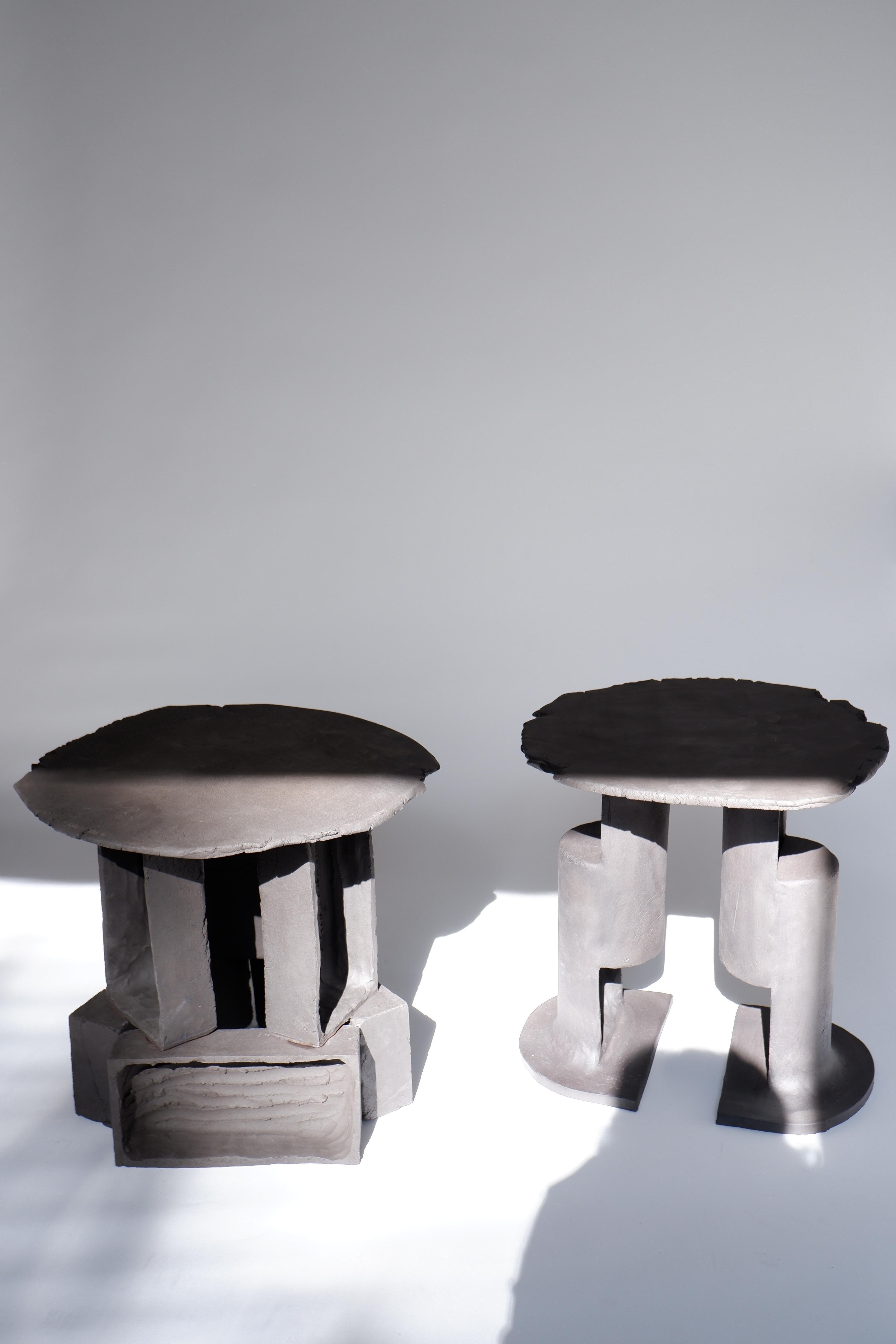 Set Of 2 T01 And T02 Coffee Tables by Ia Kutateladze
One Of  A Kind.
Dimensions: D 38 x H 37 cm (each).
Materials: Black clay.

Each piece is one of a kind, due to its free hand-building process. The top is always irregular and one of a kind.