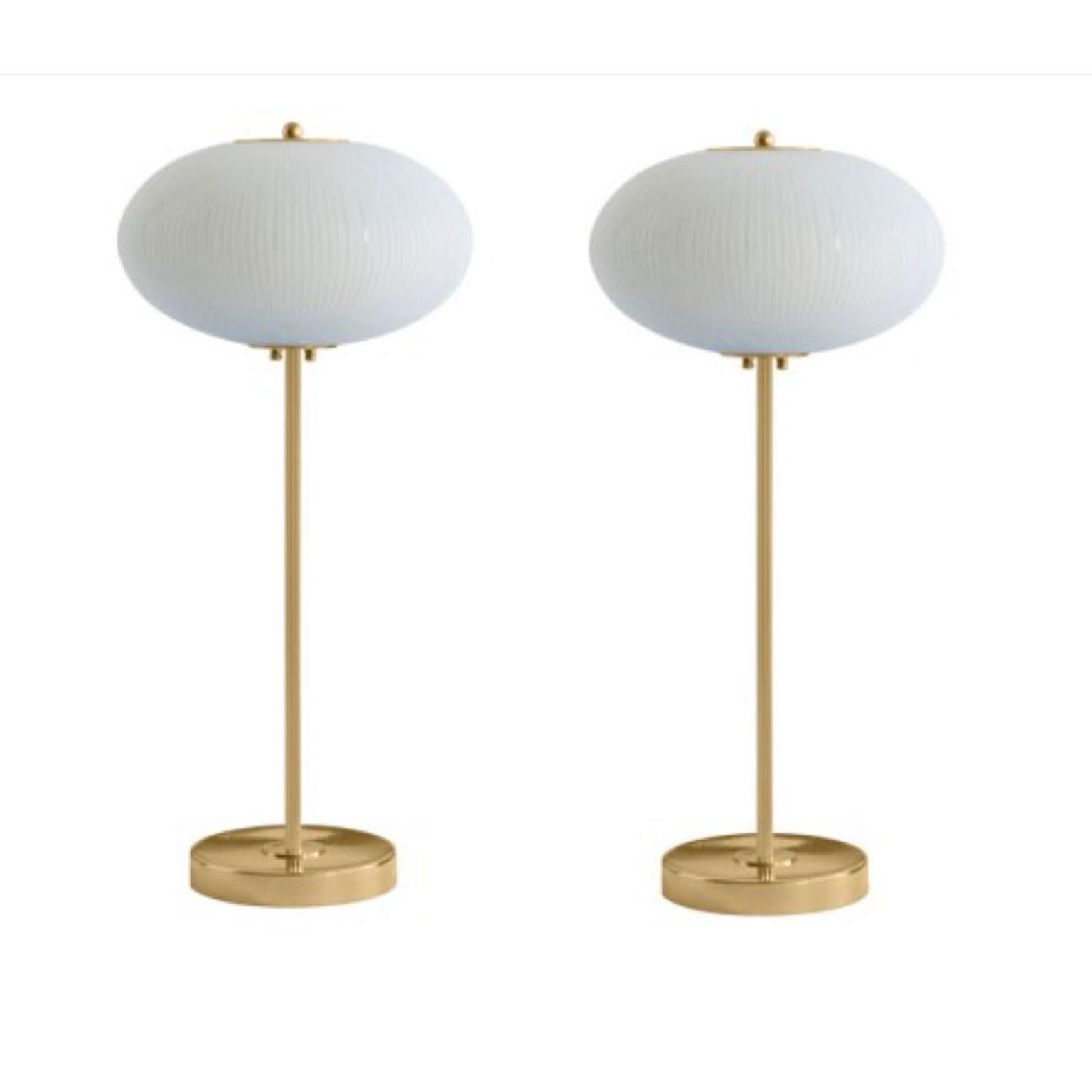 Table lamp China 07 by Magic Circus Editions.
Dimensions: H 70 x W 32 x D 32 cm.
Materials: brass, mouth blown glass sculpted with a diamond saw.
Colour: rich grey.

Available finishes: brass, nickel.
Available colours: enamel soft white, soft