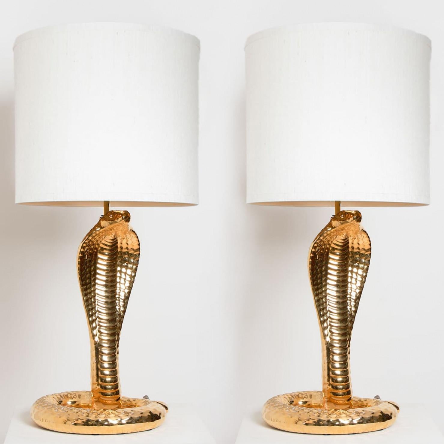 Pair of exceptional large table lamps. Unique gold-glazed ceramic table lamp in the shape of a cobra. A fine work signed by Tommaso Barbi, 1970 period. In absolutely perfect condition. With exceptional new custom made shades by René Houben. Also