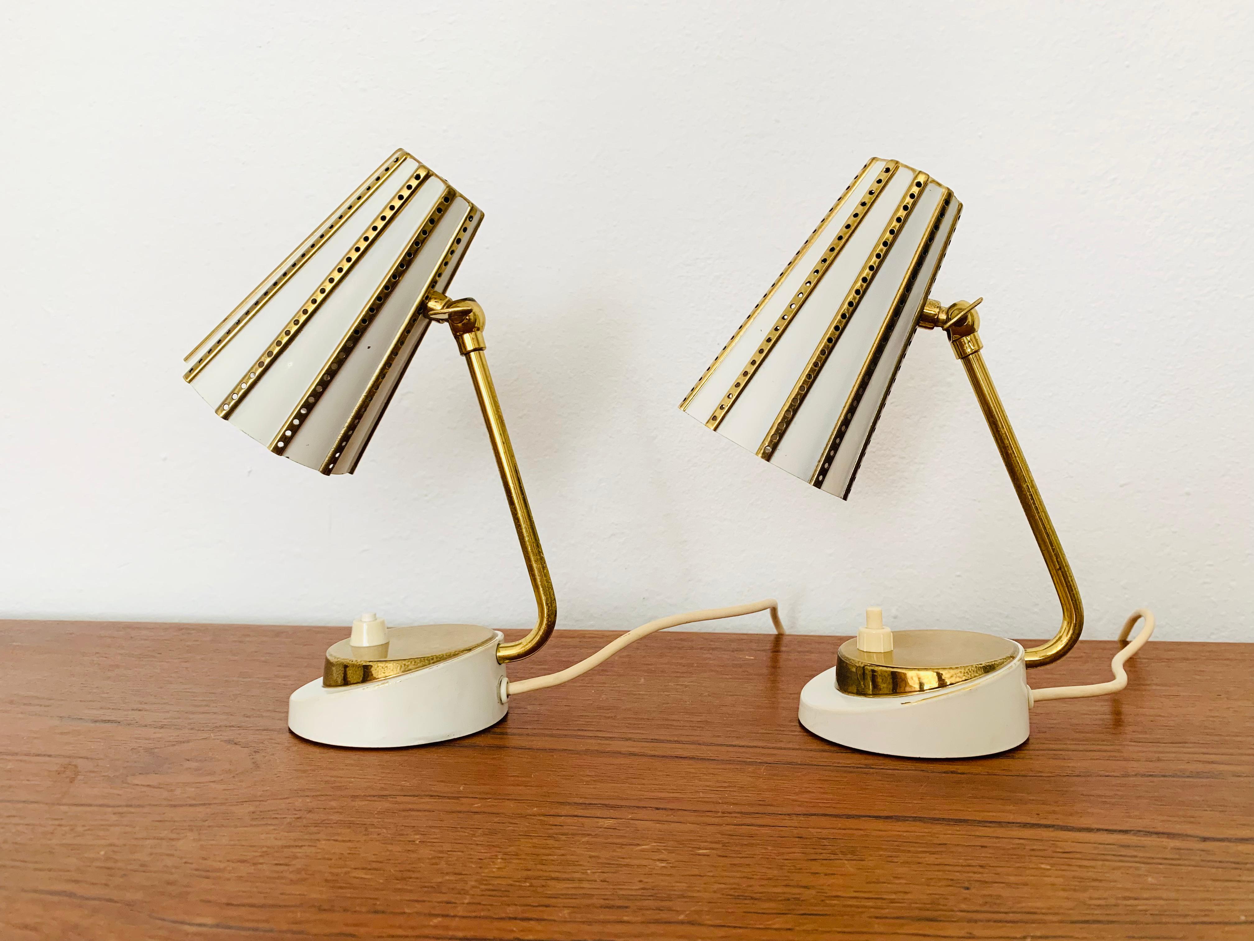 Charming table lamps from the 1950s.
The decorative lampshade spreads a great glamorous and sparkling light.
An absolute eye-catcher in every home.

Condition:

Very good vintage condition with slight signs of wear consistent with