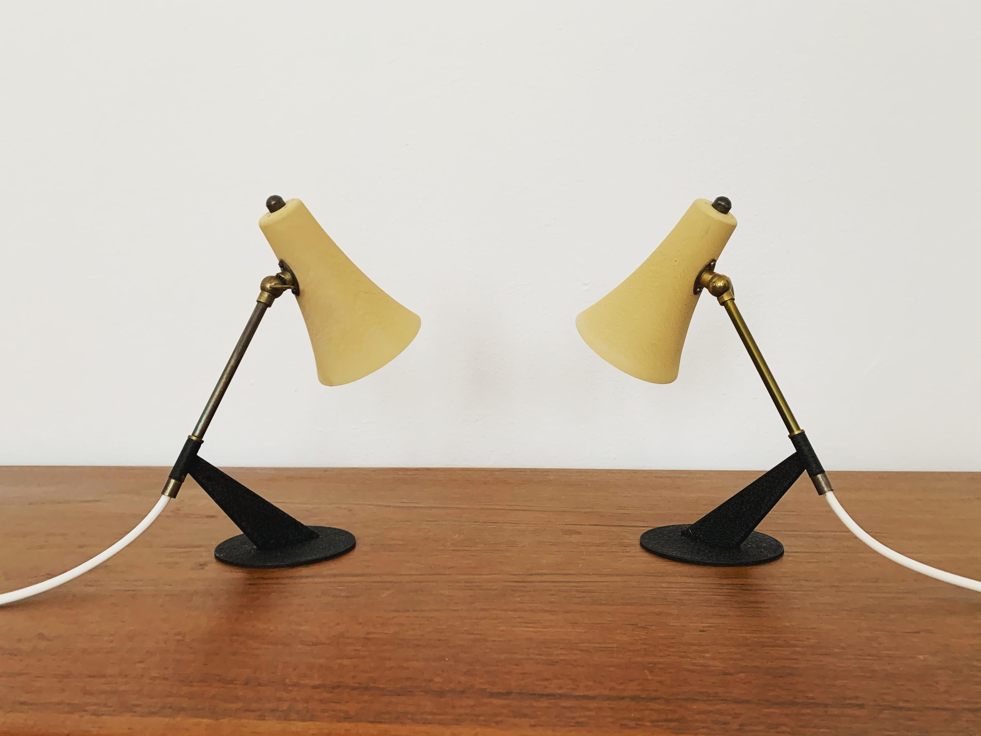 Charming table lamps from the 1950s.
Extremely beautiful design.
An absolute eye-catcher in every home.

Condition:

Very good vintage condition with slight signs of wear consistent with age.
Minimal patina that underlines the charm of the