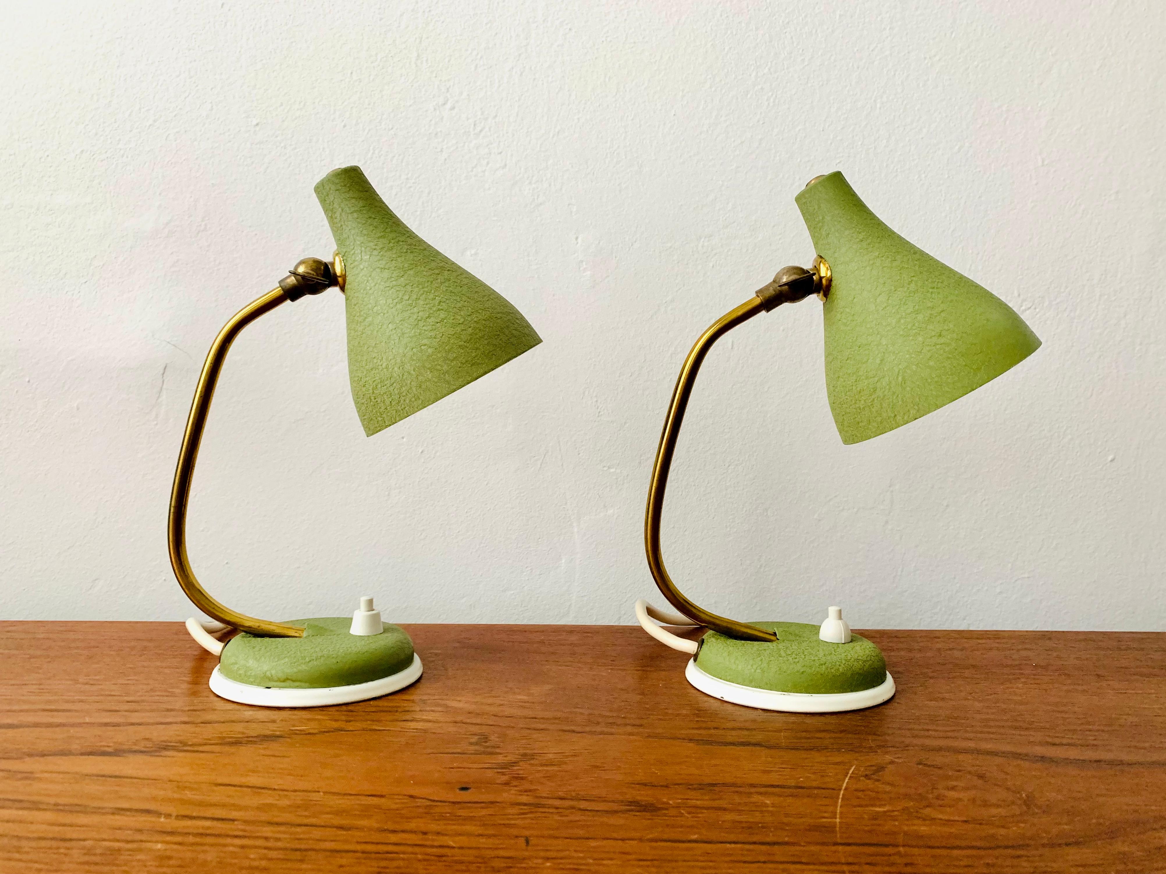 Charming table lamps from the 1950s.
Extremely beautiful design.
An absolute eye-catcher in every home.

Condition:

Very good vintage condition with slight signs of wear consistent with age.
Minimal patina that underlines the charm of the
