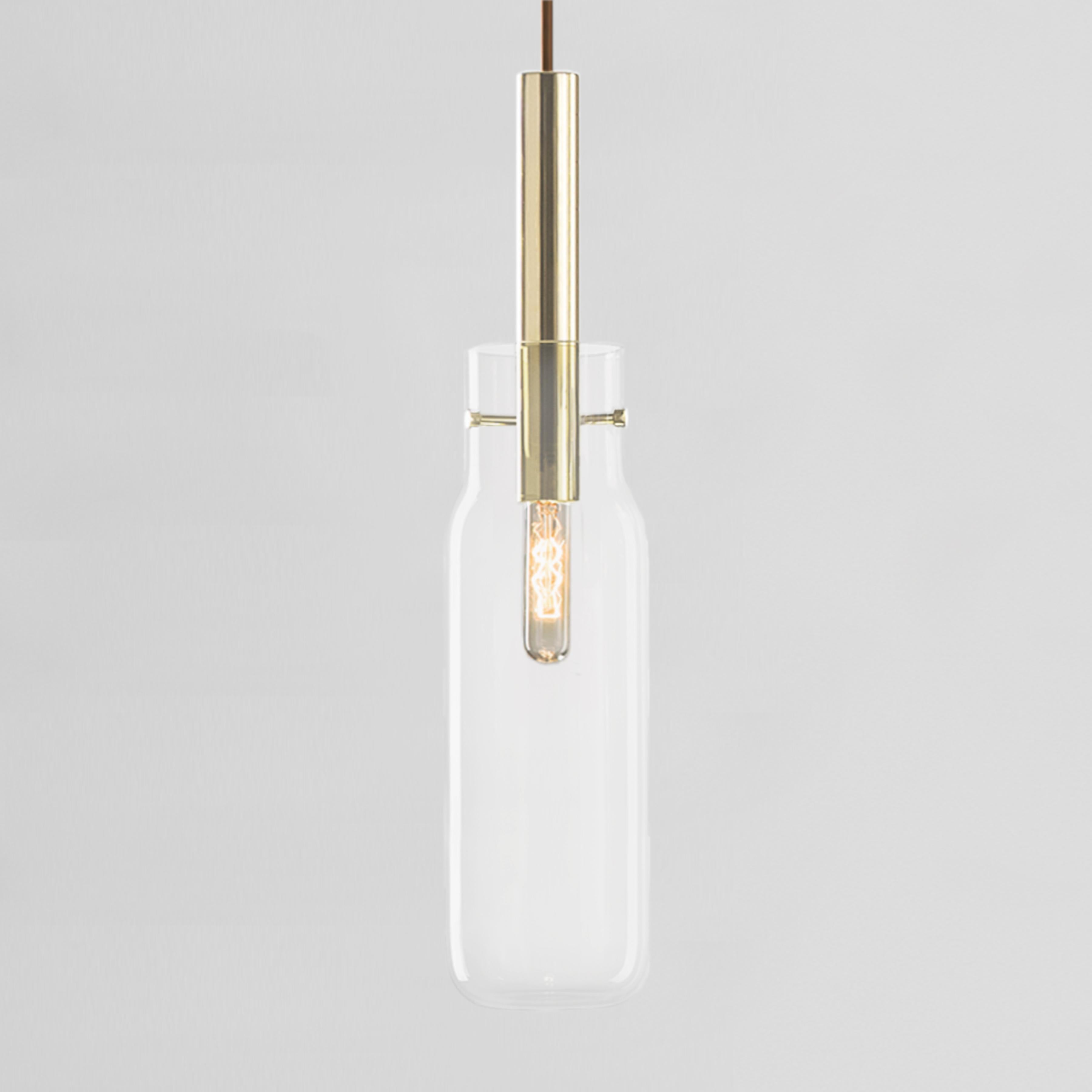Tall Bandaska pendant light by Dechem Studio
Dimensions: D 9 x H 180 cm
Materials: Brass, Glass.
Also Available: Different colours and sizes available.

hand blown into beechwood moulds, Bandaska Lights is based on the highly popular Bandaska