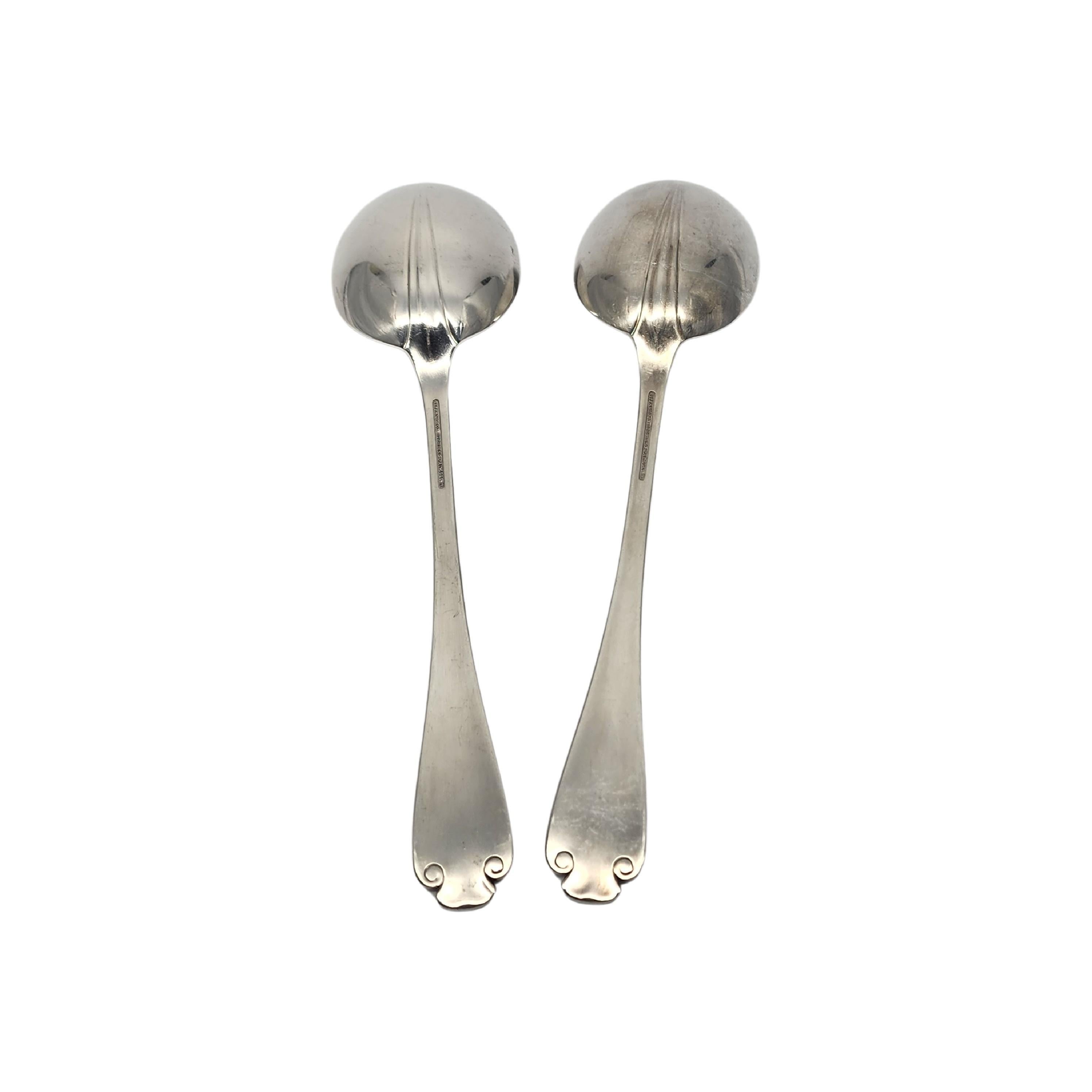 Set of 2 sterling silver serving vegetable spoons by Tiffany & Co in the Flemish pattern.

No monogram.

The Flemish pattern features a simple and elegant scroll design, making it a timeless classic that is still in demand today. Hallmarks date
