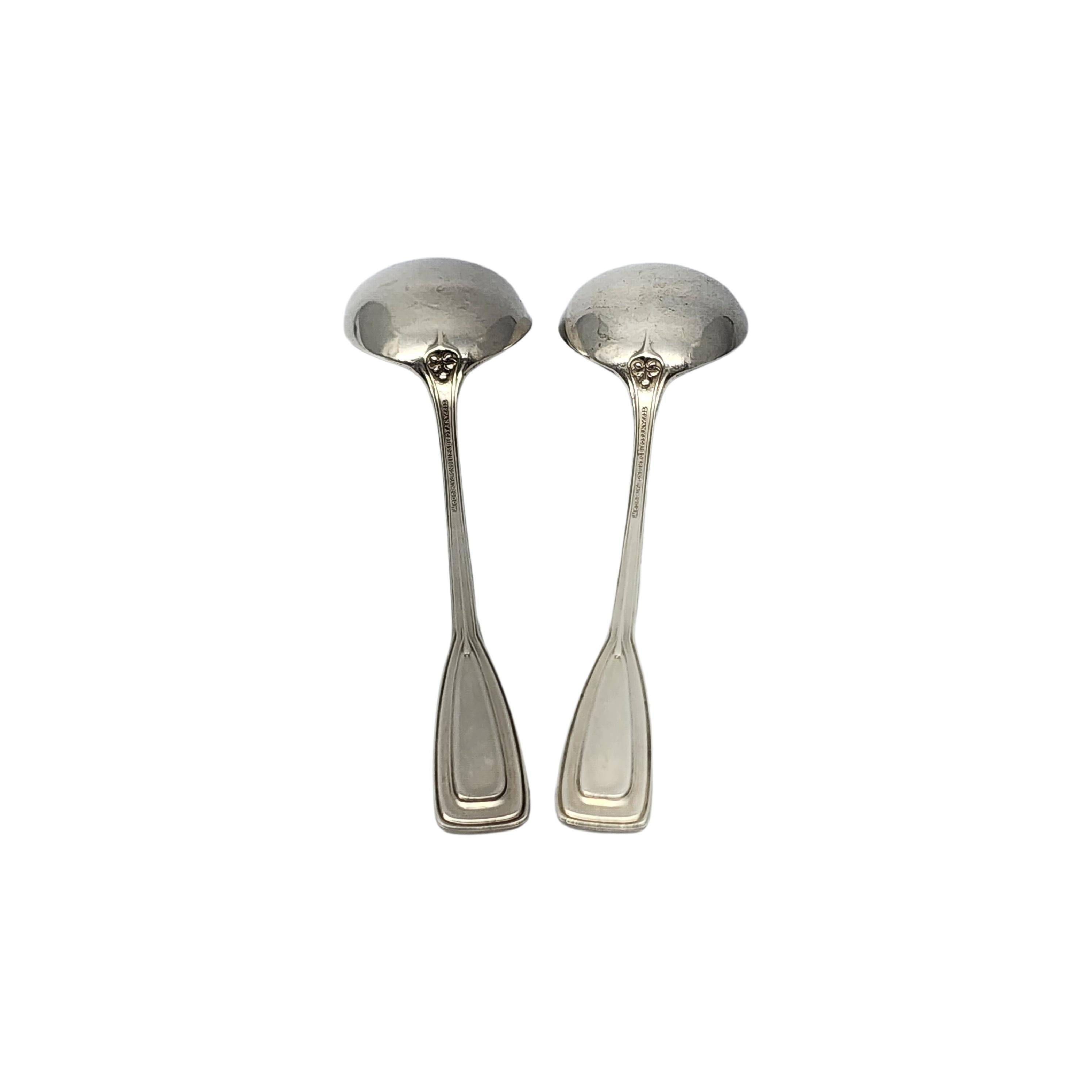 Set of 2 sterling silver round bowl bouillon soup spoons by Tiffany & Co in the St. Dunstan pattern.

No monogram.

Designed by Albert A. Southwick in 1909 and named for the patron saint of gold and silversmiths, Tiffany's St. Dunstan pattern is a
