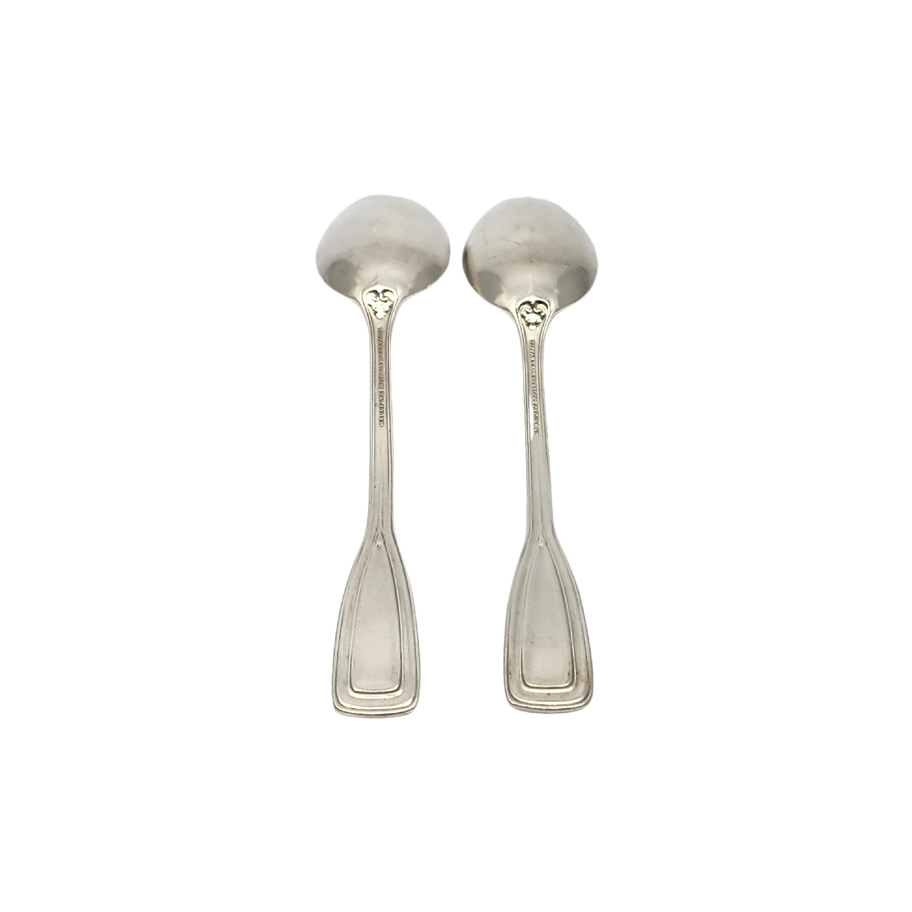 Set of 2 sterling silver place/oval soup spoons by Tiffany & Co in the St. Dunstan pattern with monogram.

Monogram appears to be W

Designed by Albert A. Southwick in 1909 and named for the patron saint of gold and silversmiths, Tiffany's St.