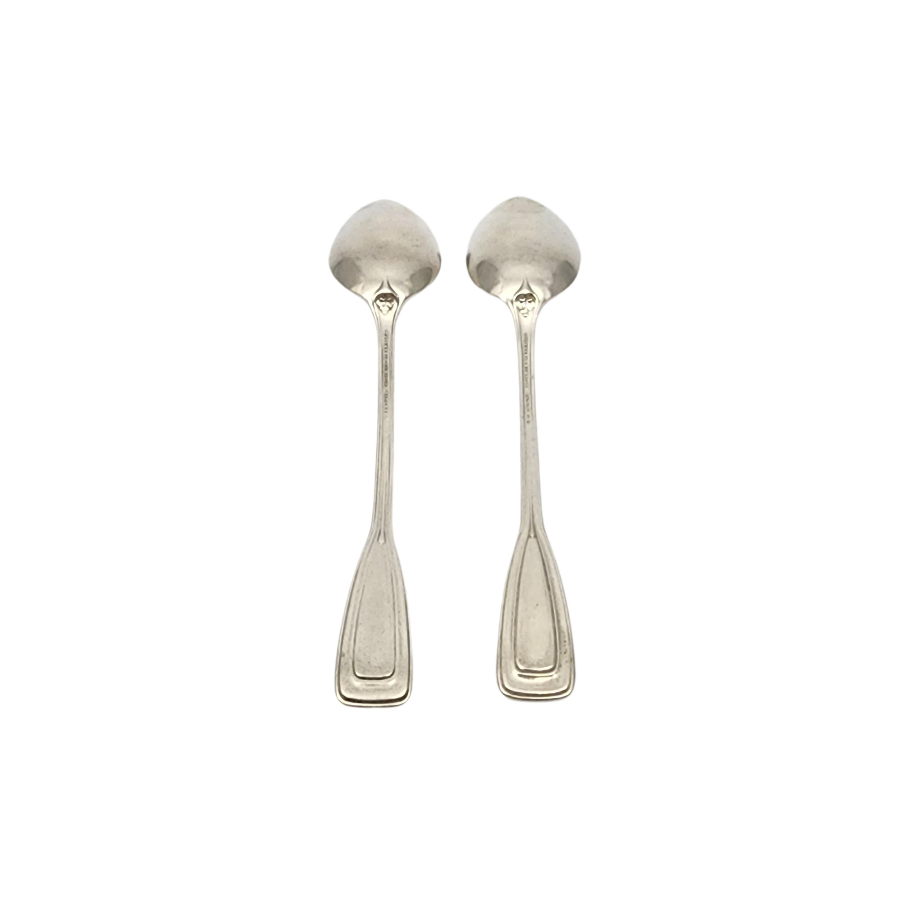 Set of 2 sterling silver teaspoons by Tiffany & Co in the St. Dunstan pattern with monogram.

Monogram appears to be W

Designed by Albert A. Southwick in 1909 and named for the patron saint of gold and silversmiths, Tiffany's St. Dunstan pattern is