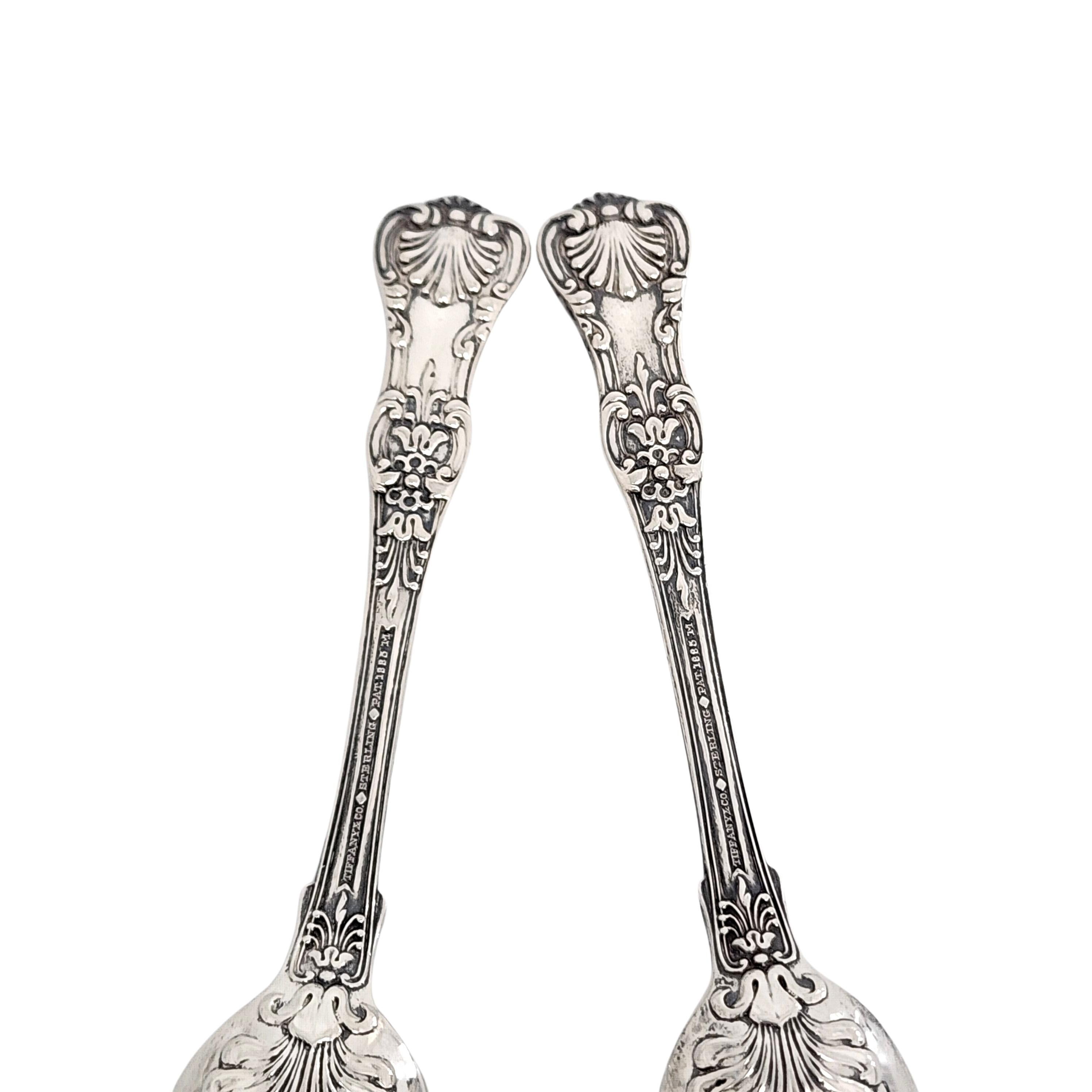 Set of 2 sterling silver demitasse spoons by Tiffany & Co in the English King pattern.

No monogram

Beautiful small demitasse spoons in Tiffany's intricate and decorative version of a King pattern, which were very popular in the late 19th century.