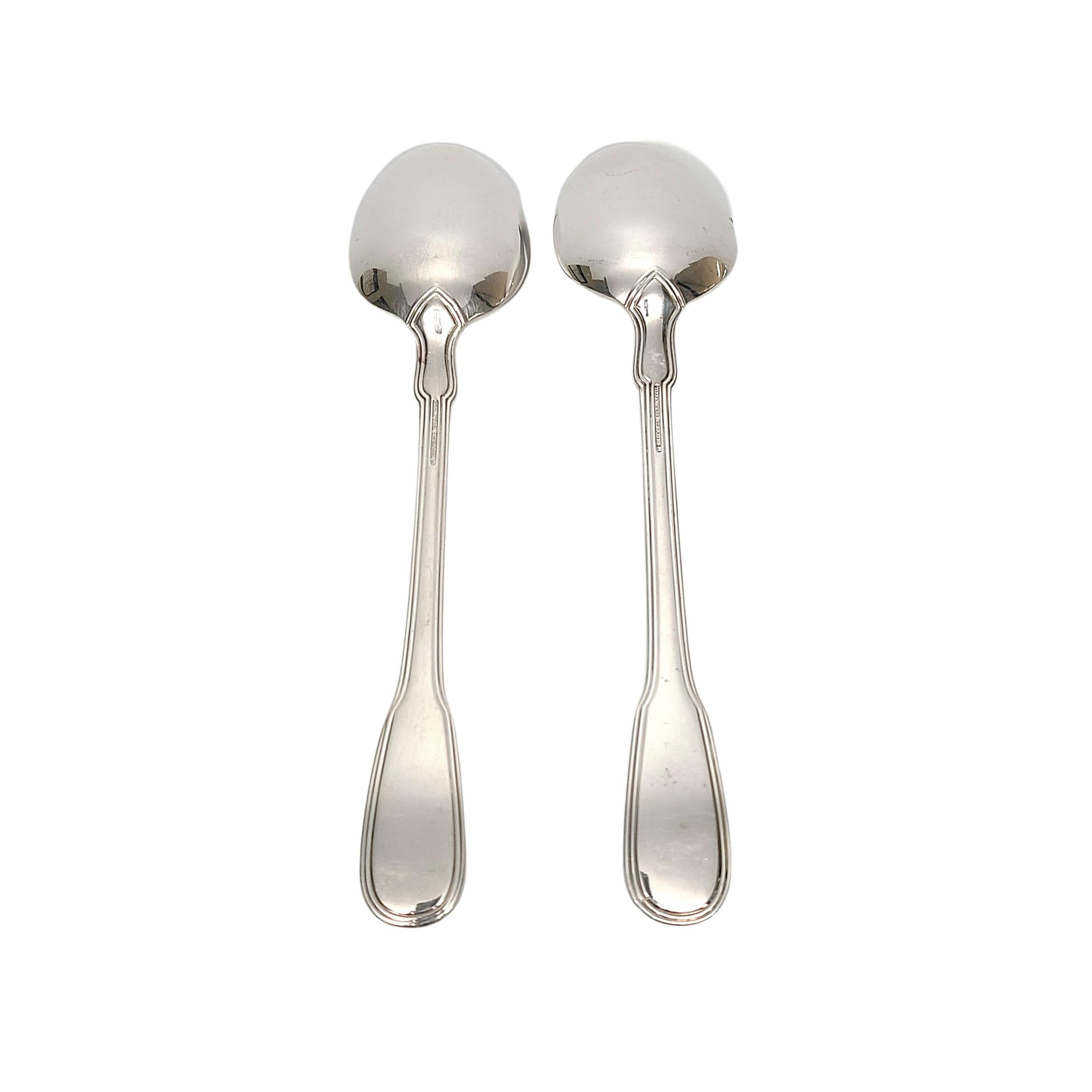 Set of 2 sterling silver serving tablespoons by Tiffany & Co in the Gramercy pattern.

Monogram appears to be LTR

2 large serving/tablespoons in the Gramercy pattern, designed by Arthur LeRoy Barney in 1921, features a simple outline design on the