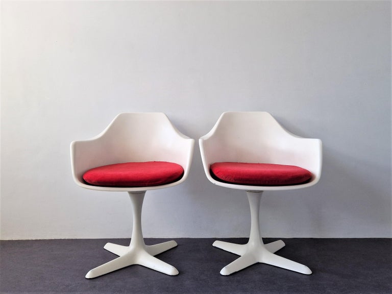The 'Tulip' dining chair was designed by Maurice Burke for Arkana in England in the early 1960's. It is an iconic Space Age design, inspired by the Eero Saarinen design for Knoll from the late 1950's. The chair is made of a firm white plastic seat