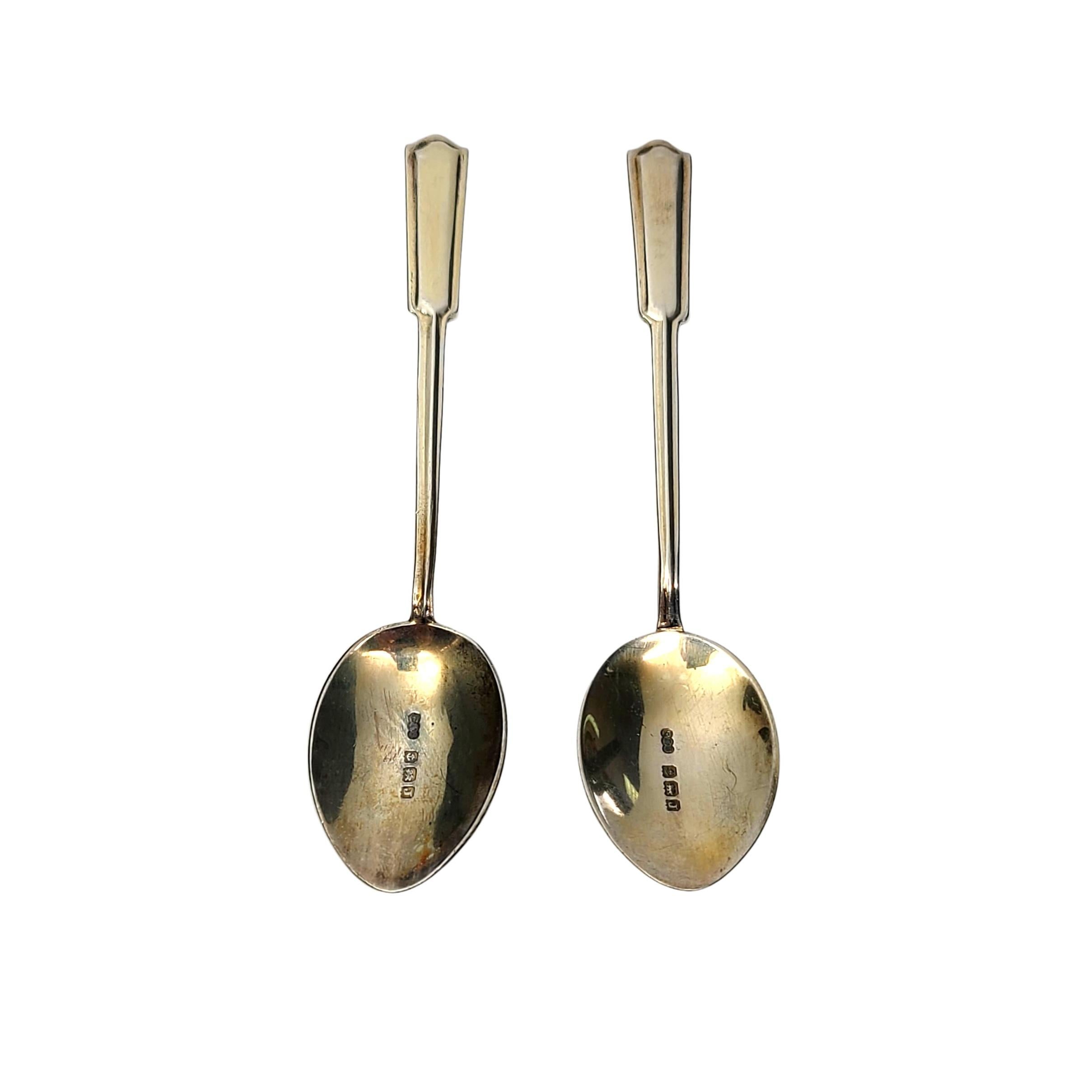 Set of 2 sterling silver and enamel demitasse spoons by Turner & Simpson of Birmingham, England, circa 1933.

No monogram

Beautifully enameled blue, black and white design on the back of the bowls and handle. Spoons have a gold wash over sterling