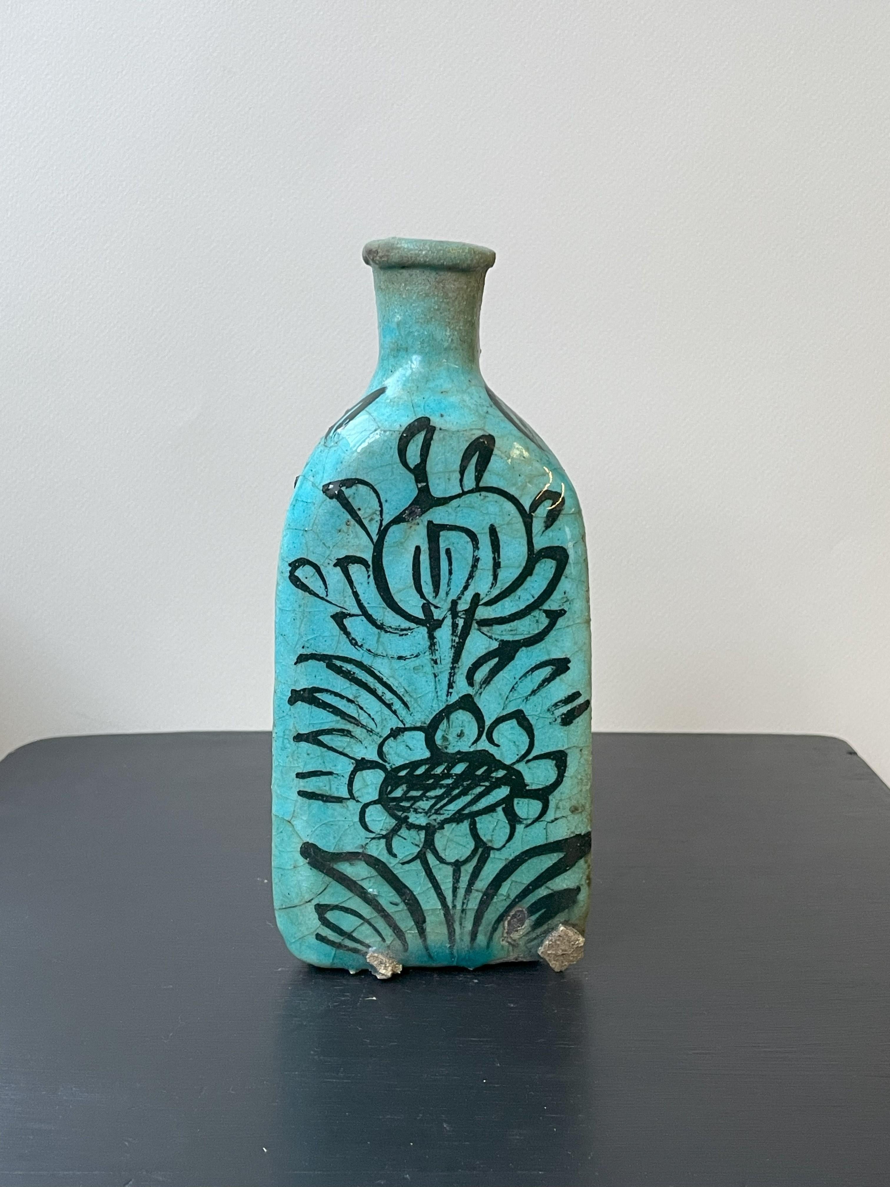 Discover cultural heritage with our set of 2 Turquoise Triangular White Qajar vases from Iraq—a pair stunning pieces that reflect rich history and exquisite craftsmanship.