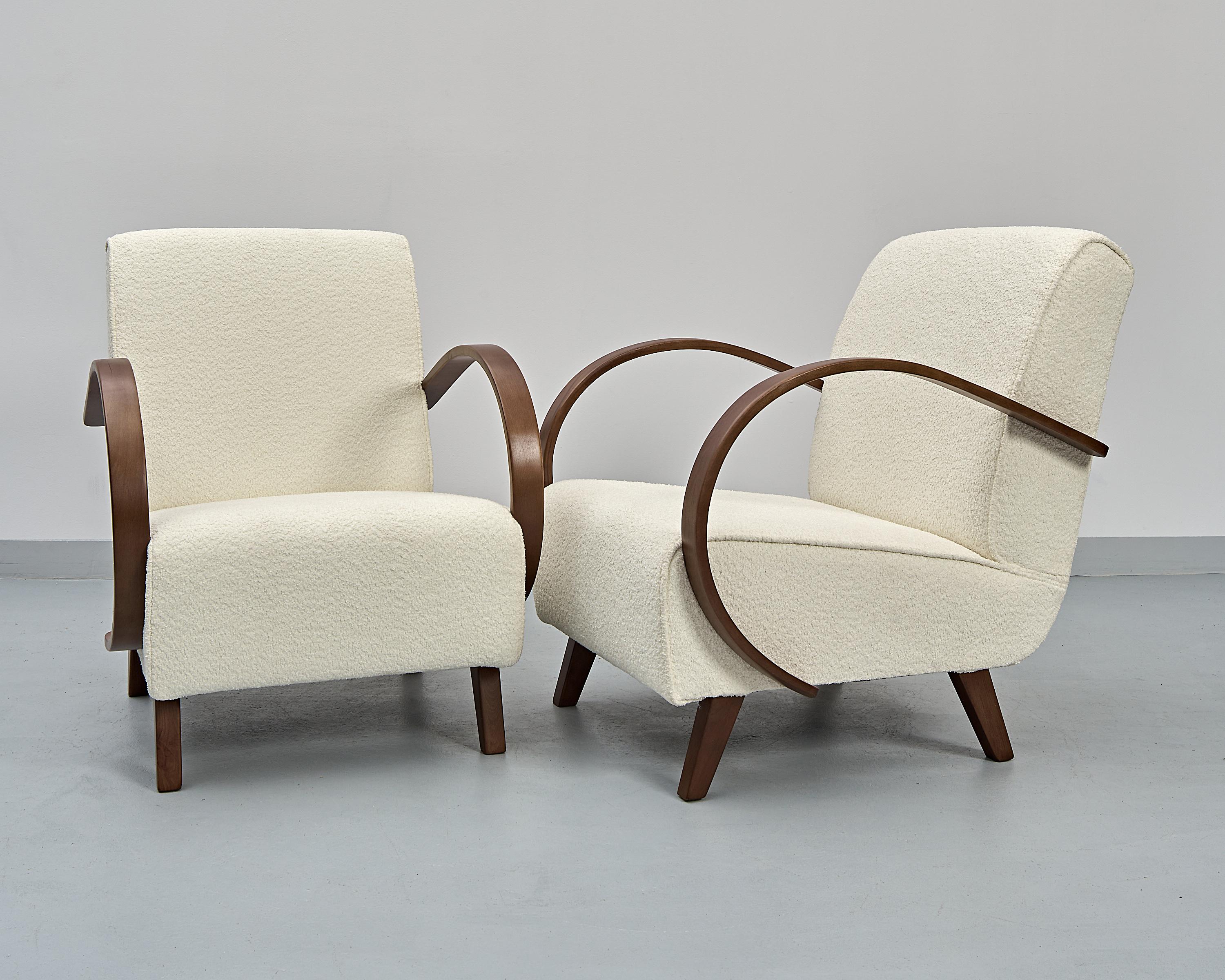 Set of 2 Type C armchairs designed by the famous czech designer Jindřich Halabala. Produced during the 1930's in former Czechoslovakia.

Oak bentwood armrests cleaned, varnished, lacquered.

Seating recreated and covered in high quality italian