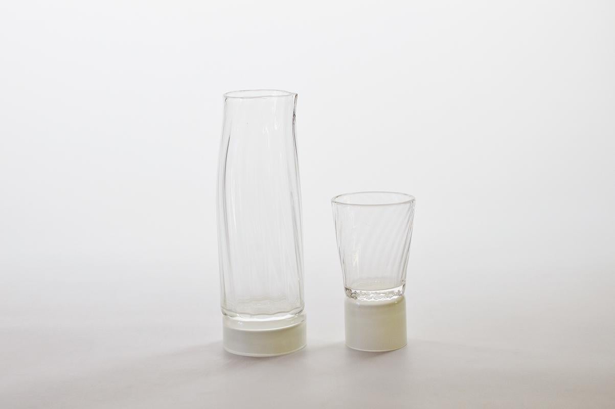 Set of 2 unique carafe and glass by Atelier George
One of a Kind
Dimensions:
Carafe: Ø 80 x H 22 cm 
Glass: Ø 75 x H 12.5 cm 
Materials: Handblown glass

Variation of colours available. 

The Moire collection is the result of a work on