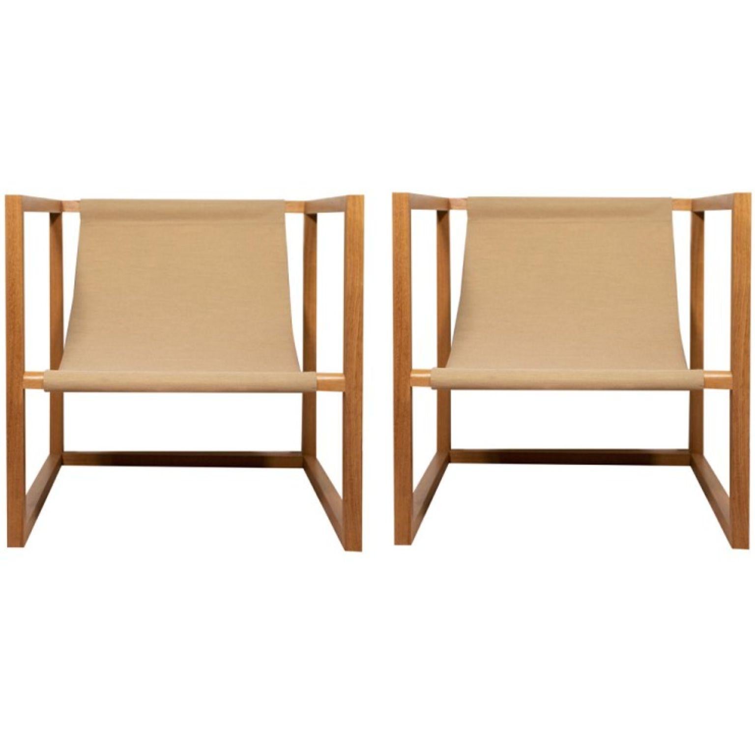 Set of 2 unique cube armchairs signed by Gigi Design
Dimensions: 70 x 70 x 70 cm
Materials: Iroko, fabric

Outdoor armchair in Iroko. Iroko is a wood suitable for exteriors. The rail moldings perfectly fit the back and legs. The canvas made by