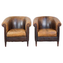 Set of 2 unique, rugged, characterful vintage sheepskin leather club chairs
