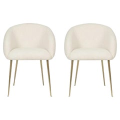 Set Of 2 Upholstered Dining Chairs With Tapered Legs in Brass.